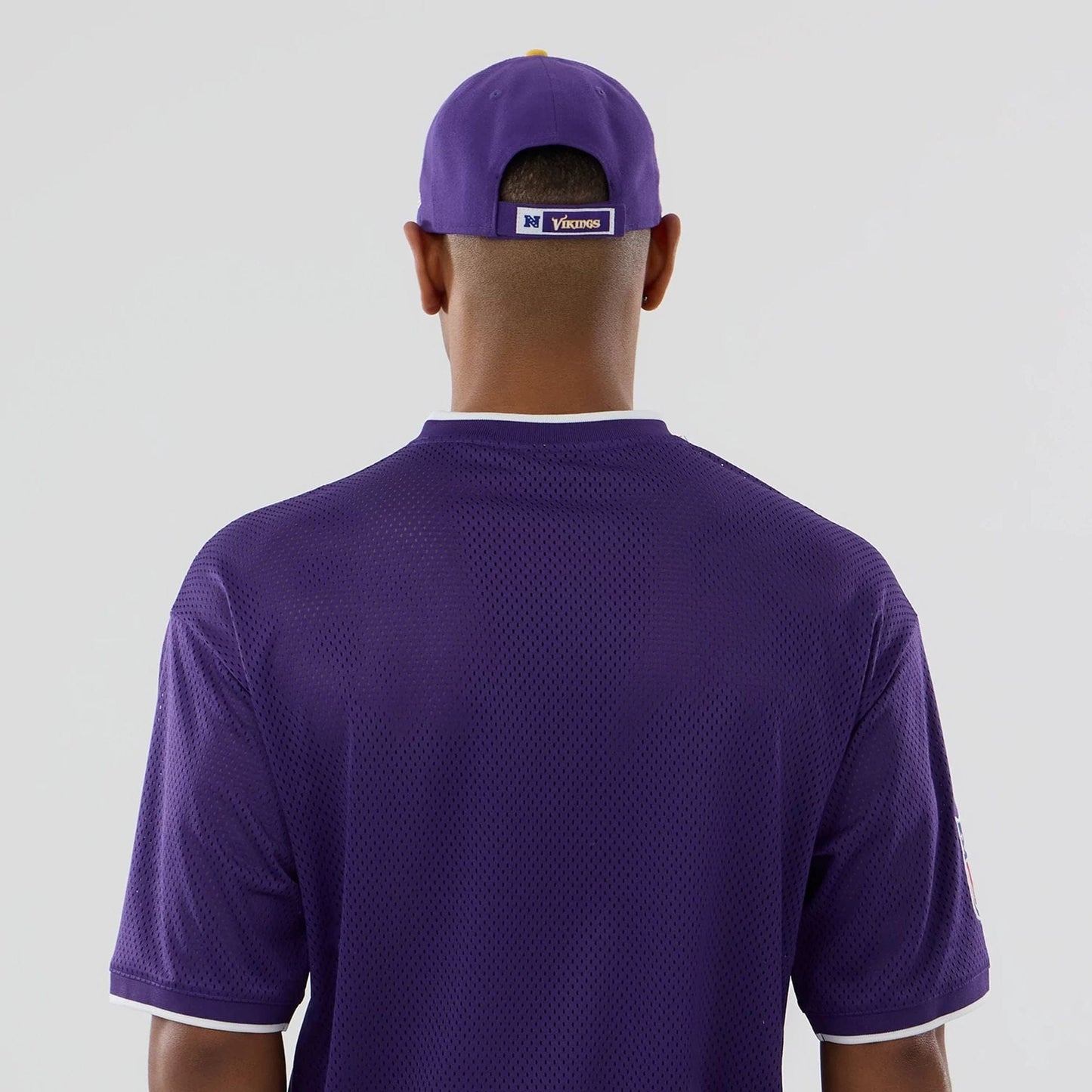 The model is wearing this NFL Mesh Minnesota Vikings Oversized T-Shirt in purple. 7