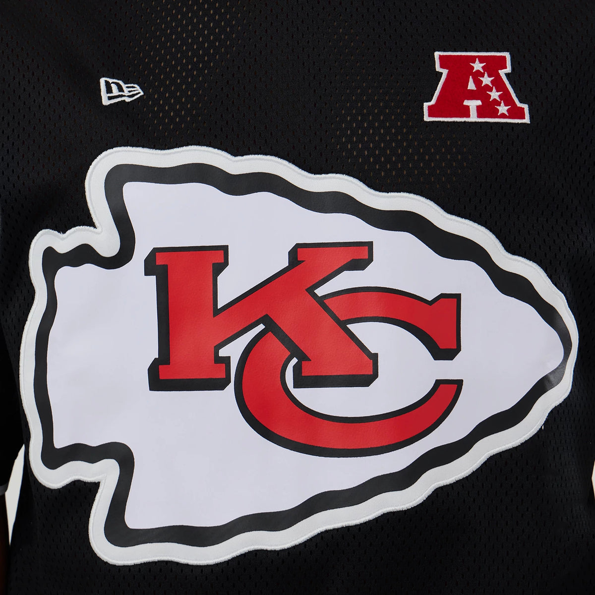 New Era Kansas City Chiefs NFL Mesh Black Oversized T-Shirt, front view showing a large red and white KC logo in the centre, an embroidered New Era logo on the chest, and a red AFC patch above.