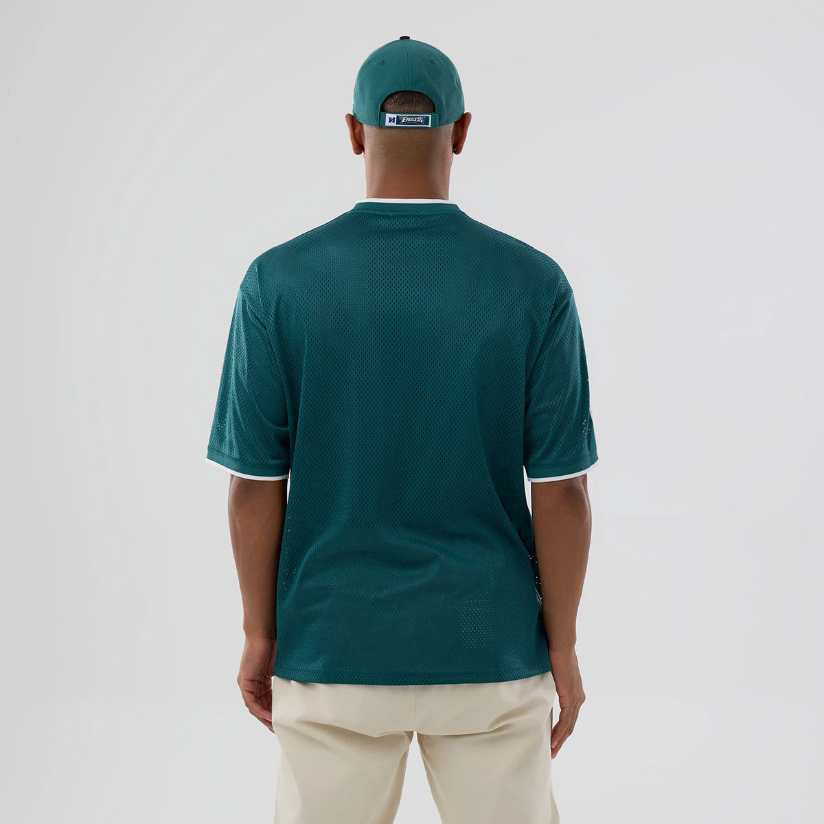 The model is wearing this NFL Mesh Philadelphia Eagles Oversized T-Shirt in dark green. 2