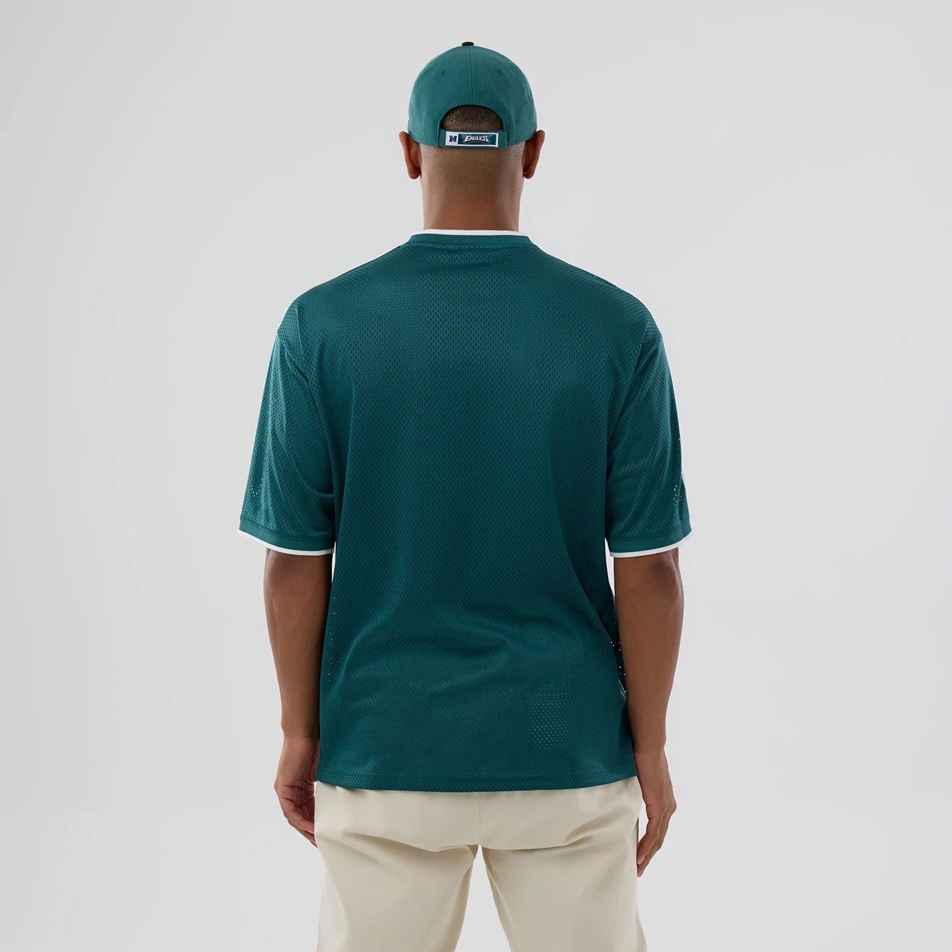 The model is wearing this NFL Mesh Philadelphia Eagles Oversized T-Shirt in dark green. 2
