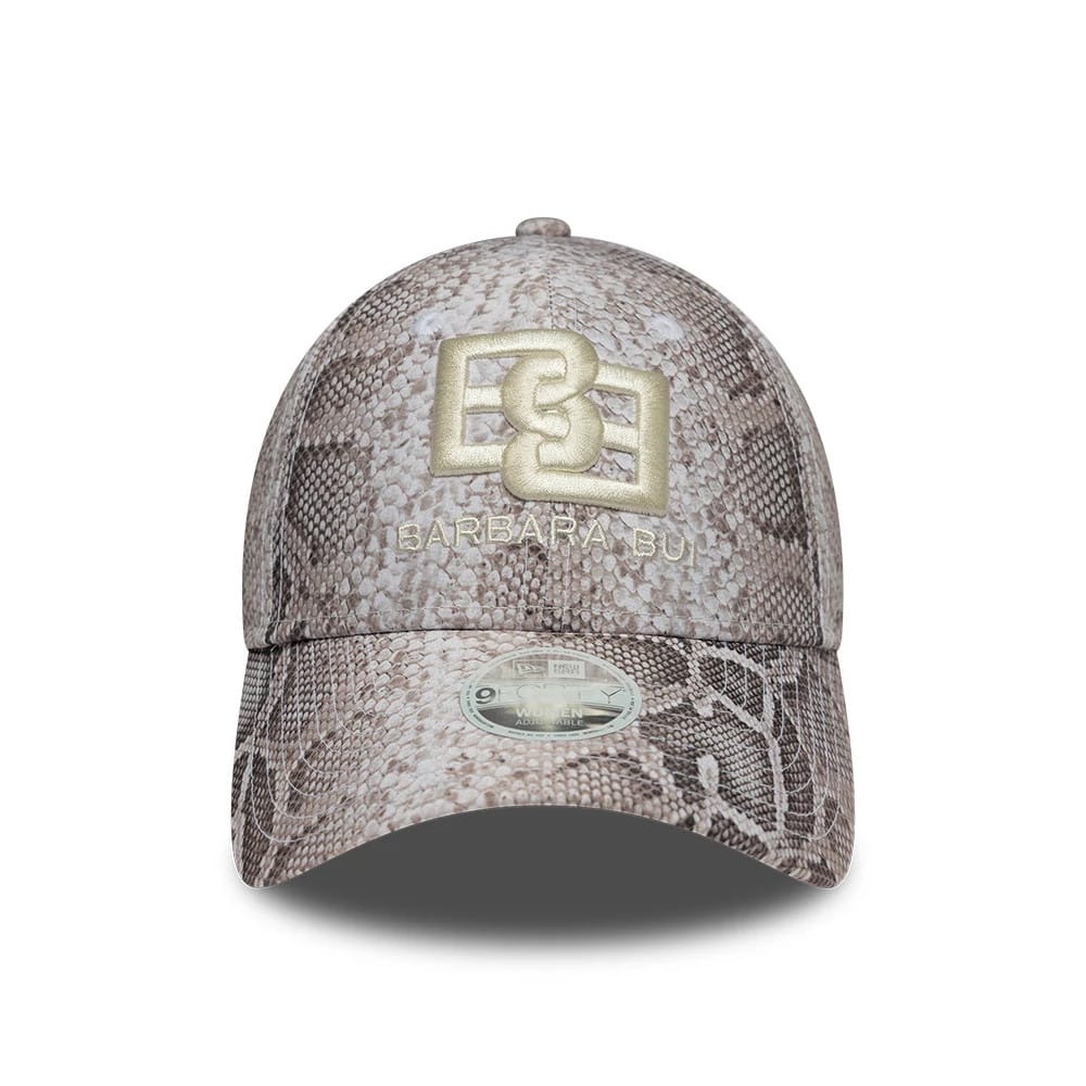 Womens New Era X Barbara Bui Python All Over Print 9FORTY Adjustable Cap, front view showing the gold embroidered Barbara Bui logo on the structured crown with a matching python print visor and a 9FORTY size sticker.