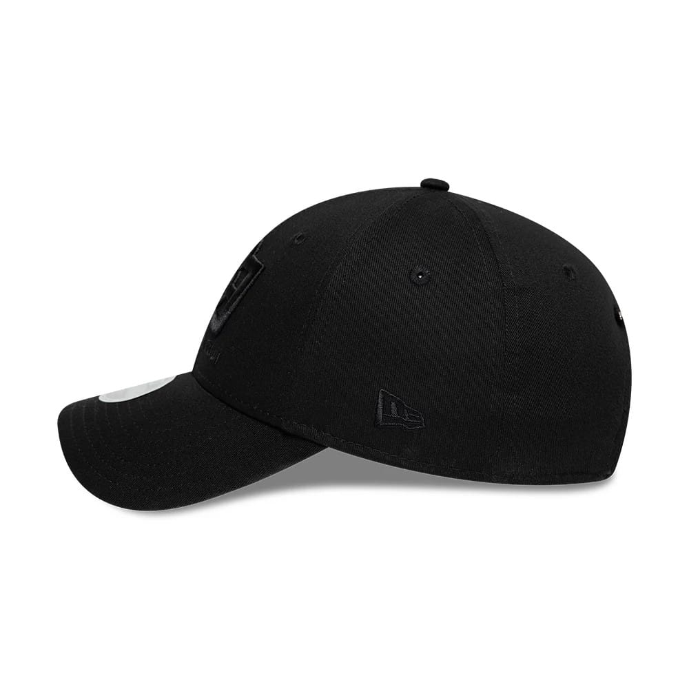 Womens New Era X Barbara Bui Core Black 9FORTY Adjustable Cap, side view showing the black New Era flag logo on the left side of the structured black crown with a curved visor and a 9FORTY size sticker.