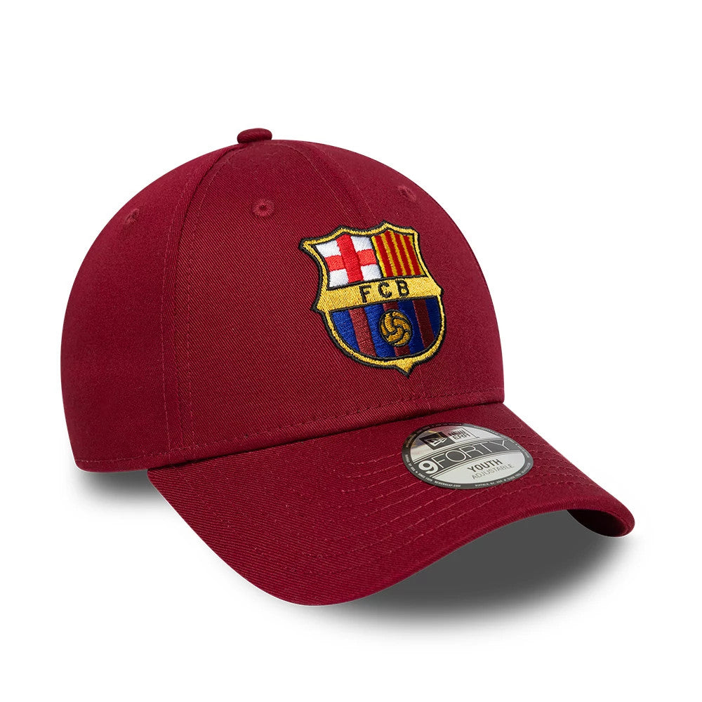 FC Barcelona Youth Core Dark Red New Era 9FORTY Adjustable Cap, three-quarter view showing the colourful embroidered FC Barcelona crest on the front panel, with a pre-curved dark red visor and 9FORTY size sticker on top.