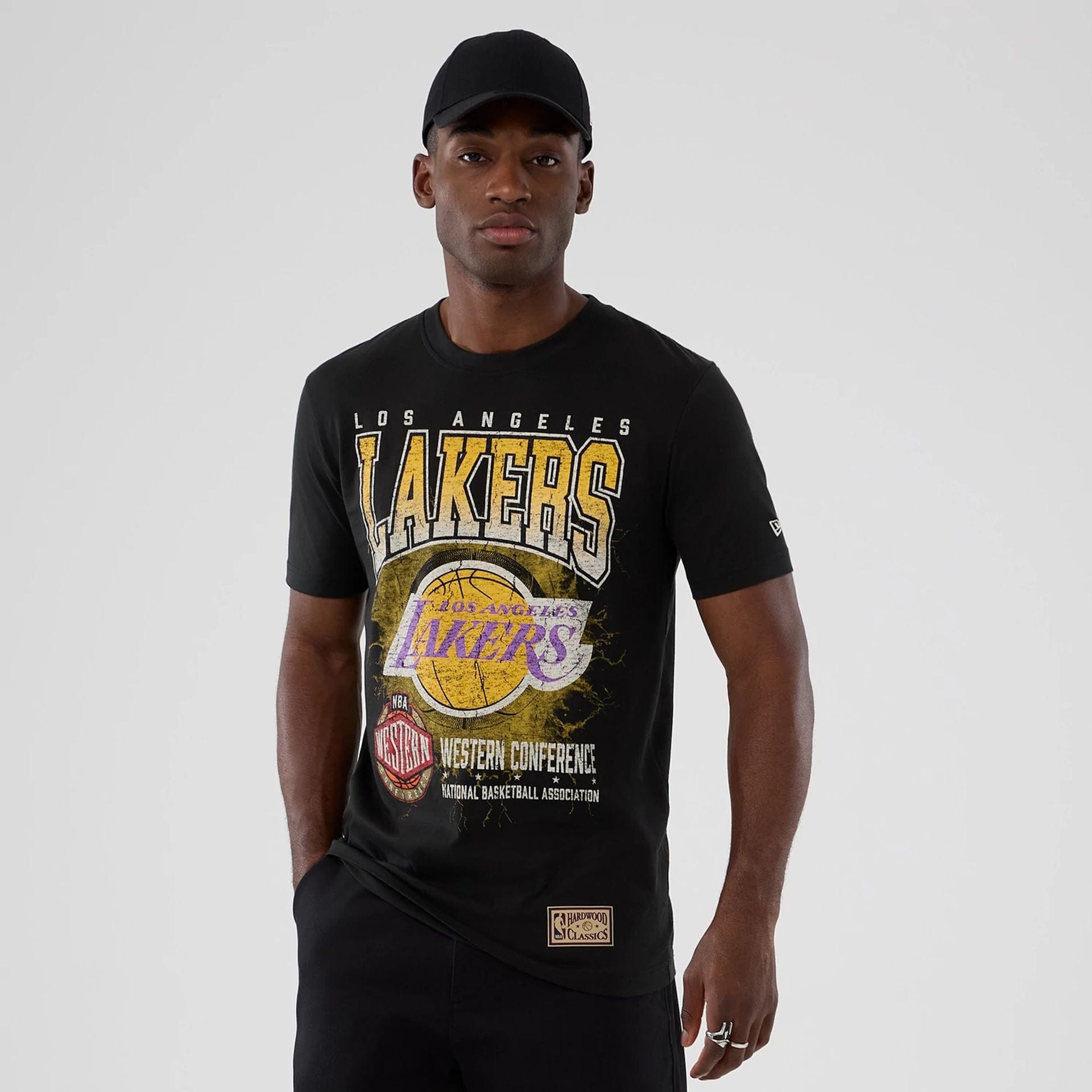 The model is wearing this NBA Hardwood Classic LA Lakers T-Shirt in black. 1