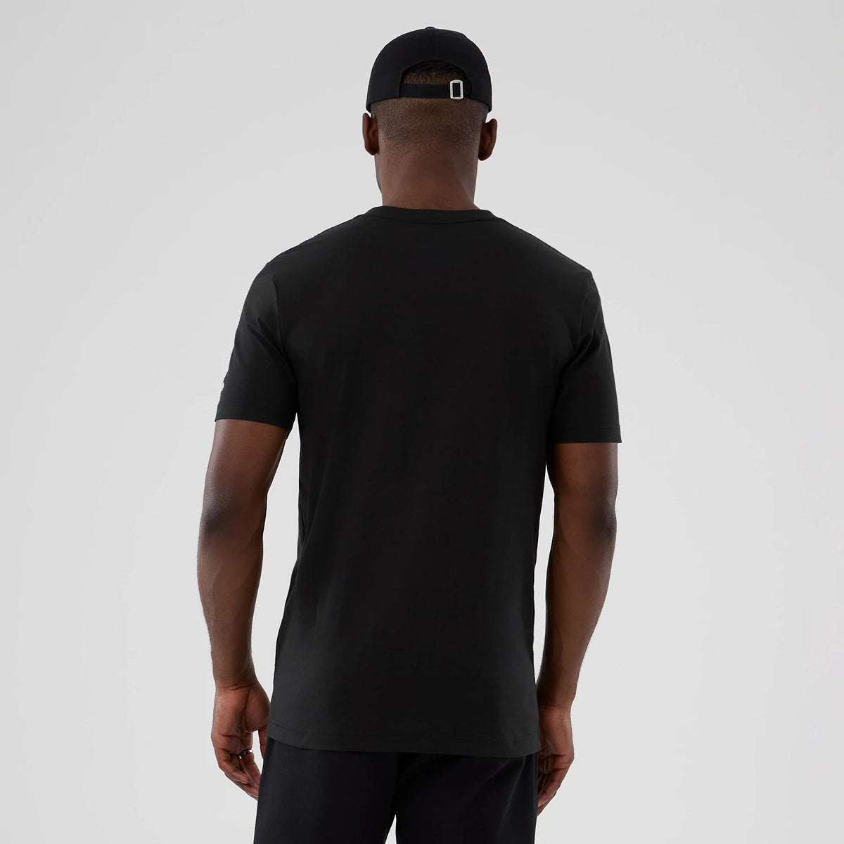 New Era LA Lakers NBA Hardwood Classic Black T-Shirt, back view showing the plain black design with short sleeves and a crew neck, styled simply on-model against a neutral background.