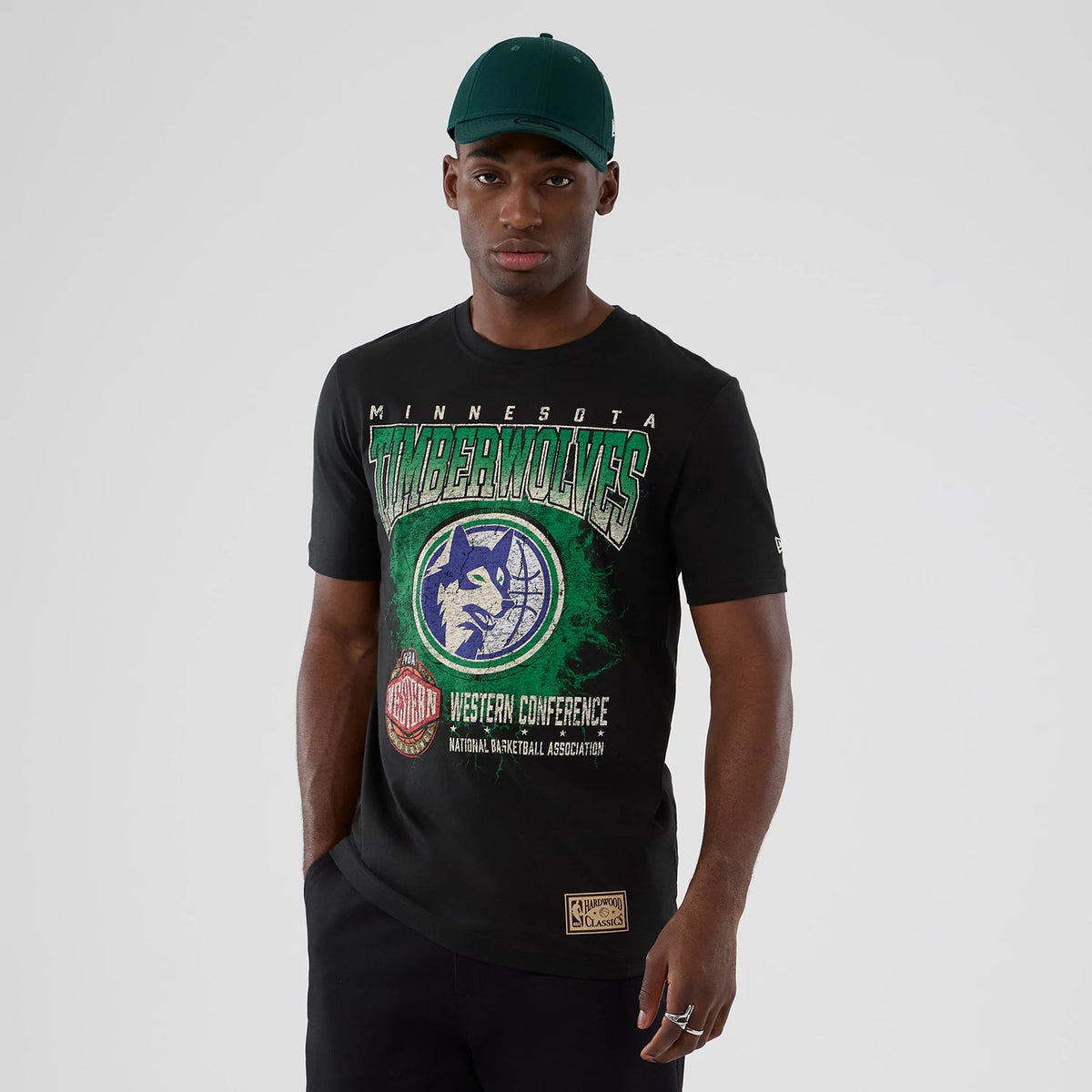The model is wearing this NBA Hardwood Classic Minnesota Timberwolves T-Shirt in black. 1