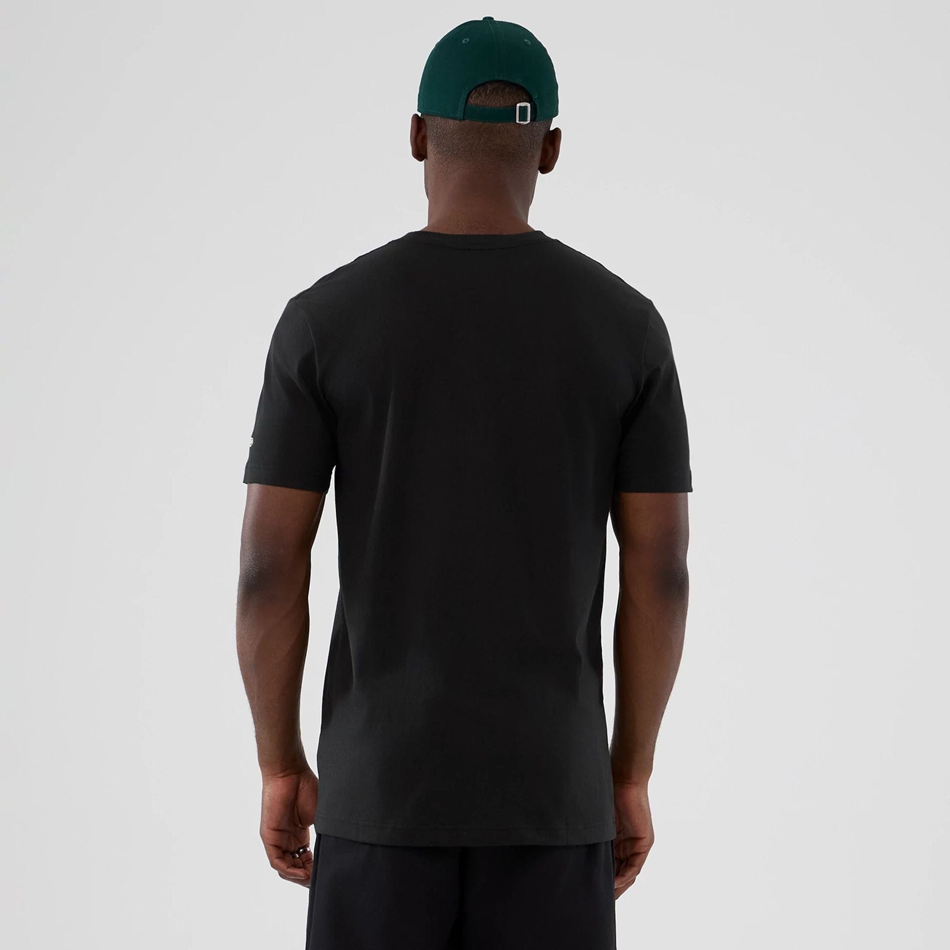 The model is wearing this NBA Hardwood Classic Minnesota Timberwolves T-Shirt in black. 2