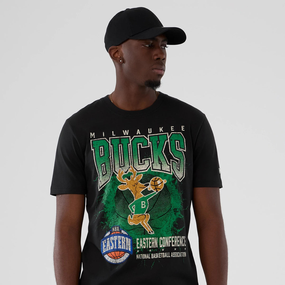 The model is wearing this NBA Hardwood Classic Milwaukee Bucks T-Shirt in black. 7