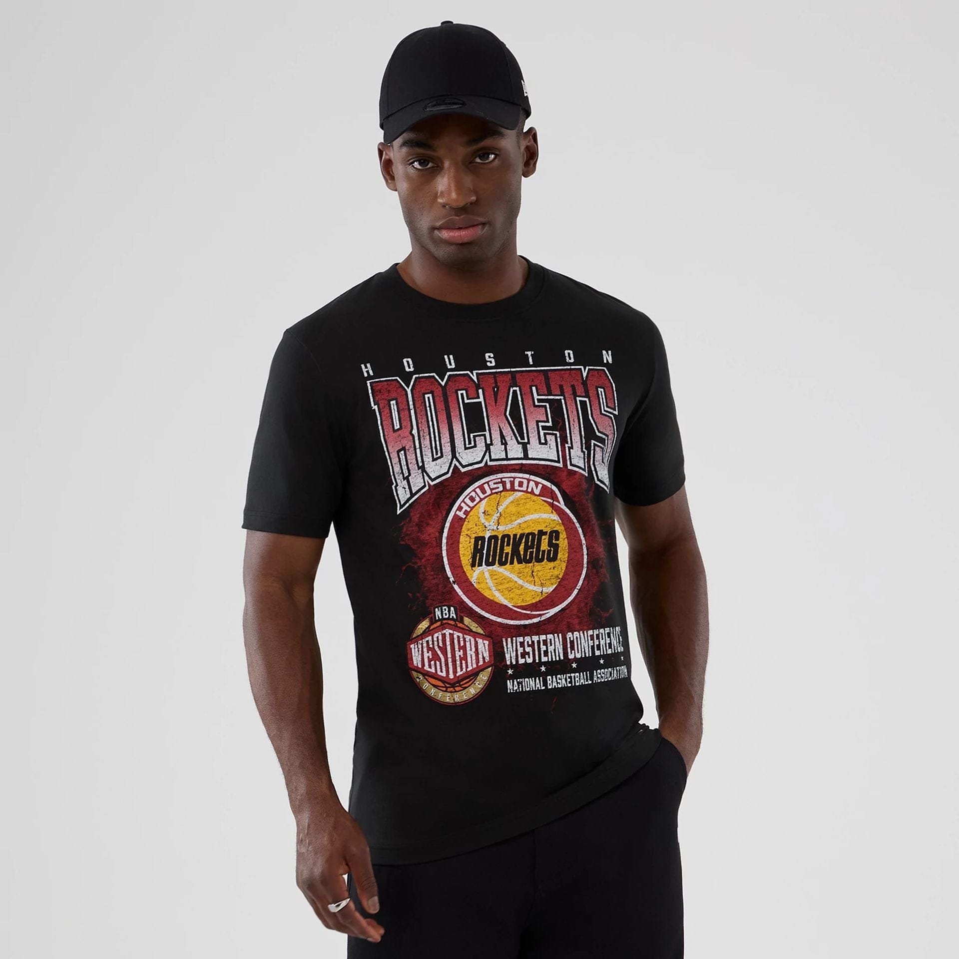 The model is wearing this NBA Hardwood Classic Houston Rockets T-Shirt in black. 1