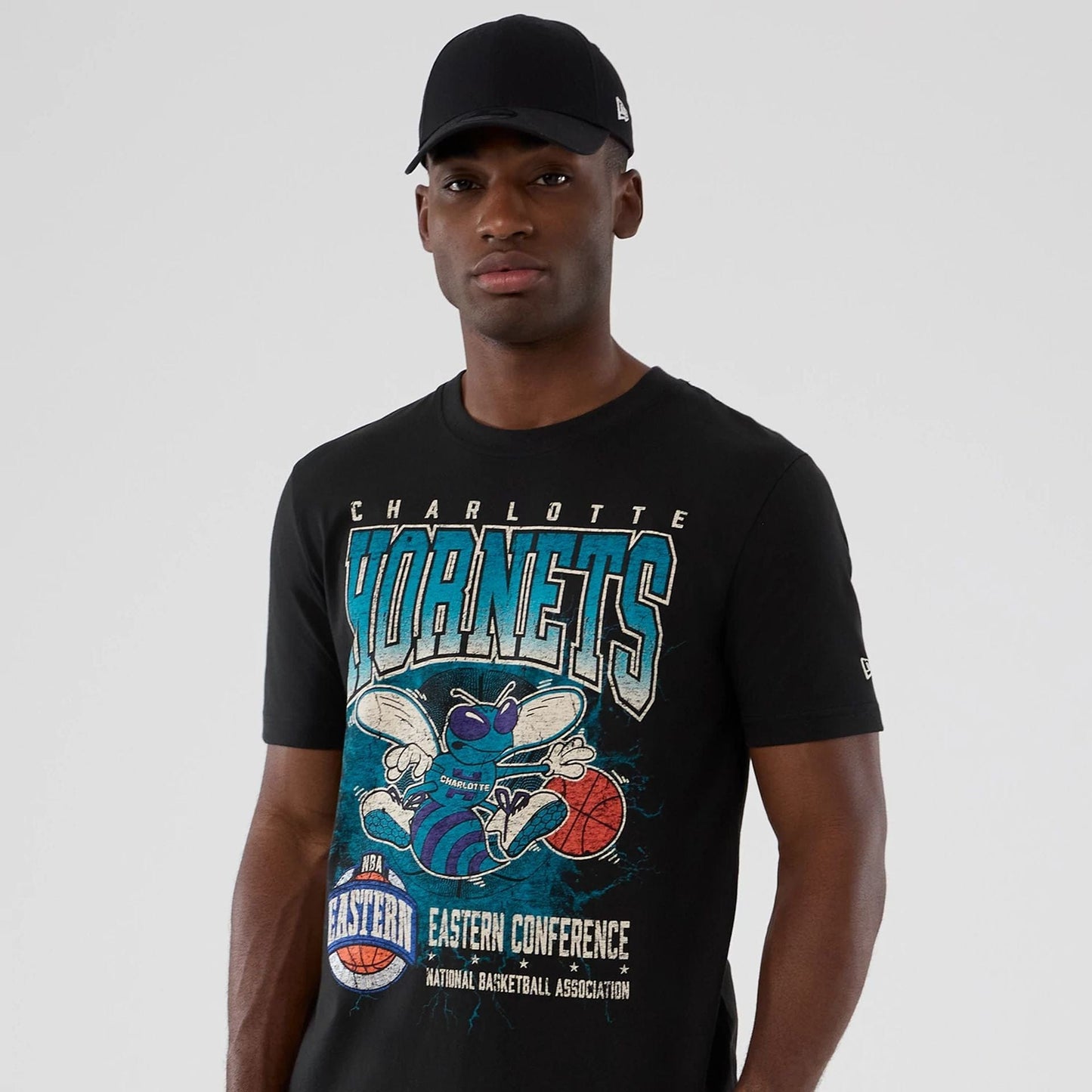 The model is wearing this NBA Hardwood Classic Charlotte Hornets T-Shirt in black. 7