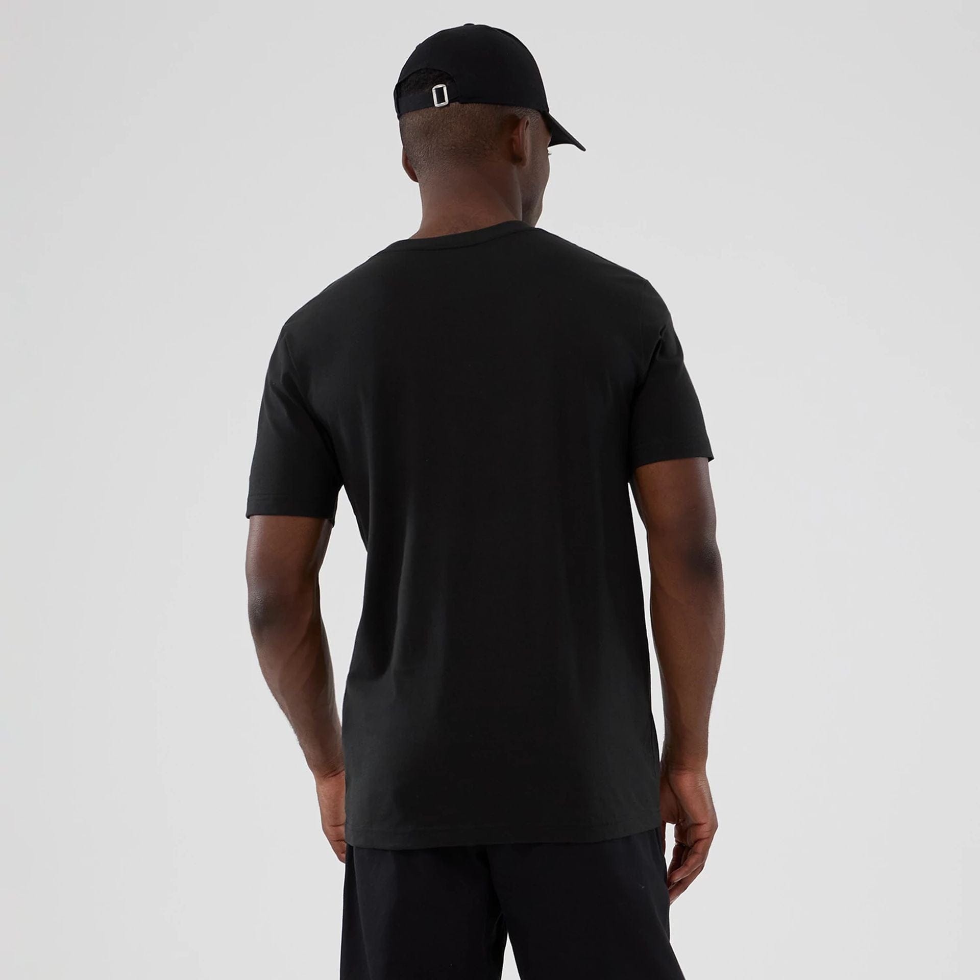 The model is wearing this NBA Hardwood Classic Charlotte Hornets T-Shirt in black. 2