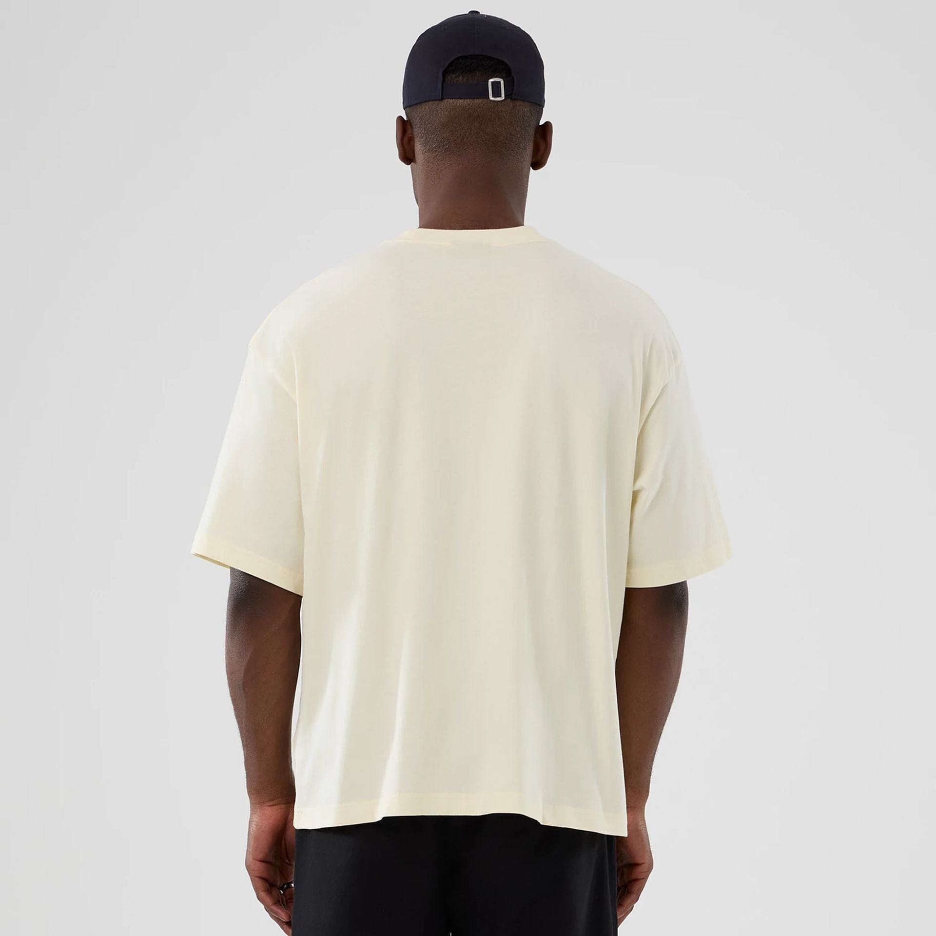 The model is wearing this NBA Hardwood Classic Detroit Pistons T-Shirt in cream. 2