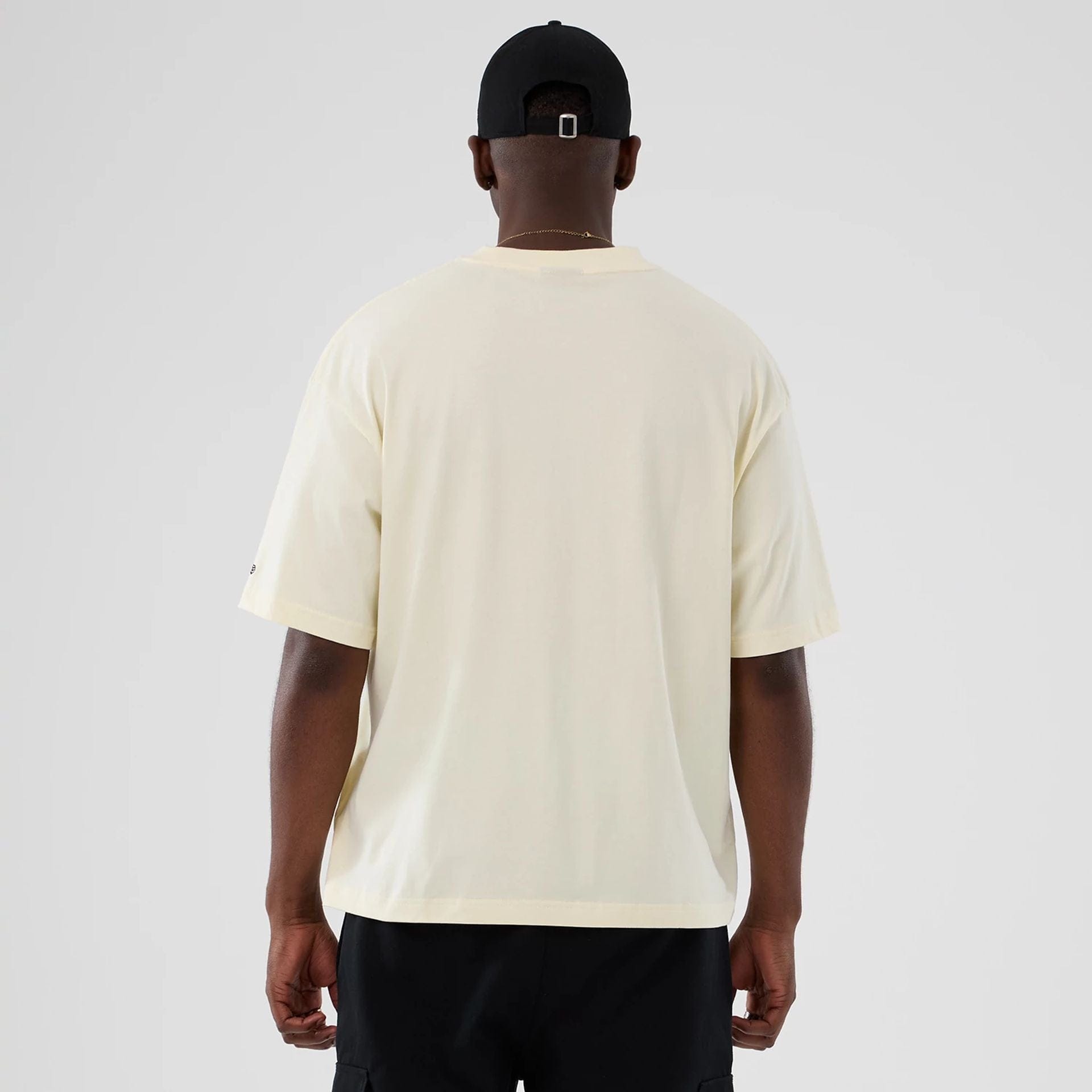 The model is wearing this NBA Hardwood Classic Toronto Raptors T-Shirt in Cream . 2