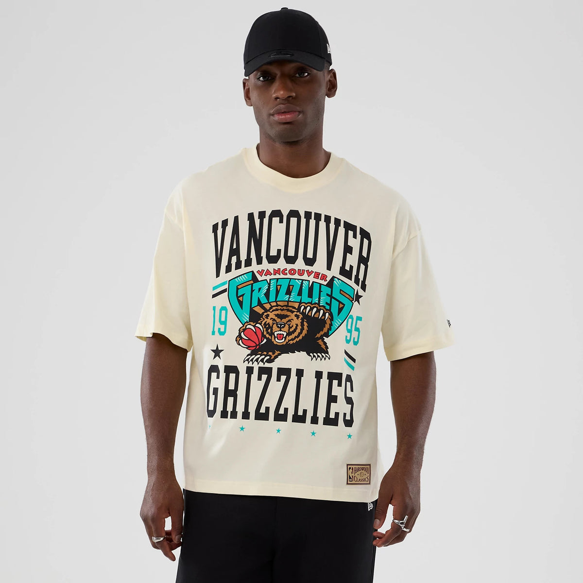 The model is wearing this NBA Hardwood Classic Vancouver Grizzlies T-Shirt in Cream. 1