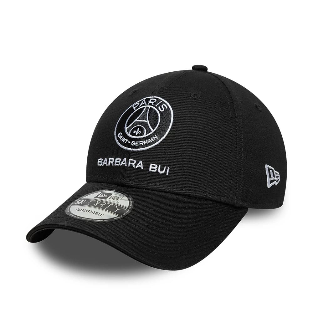 Barbara Bui x Paris Saint-Germain Black New Era 9FORTY Adjustable Cap, three-quarter view showing the white Paris Saint-Germain and Barbara Bui embroidery on the front panel, curved black visor with a 9FORTY size sticker.