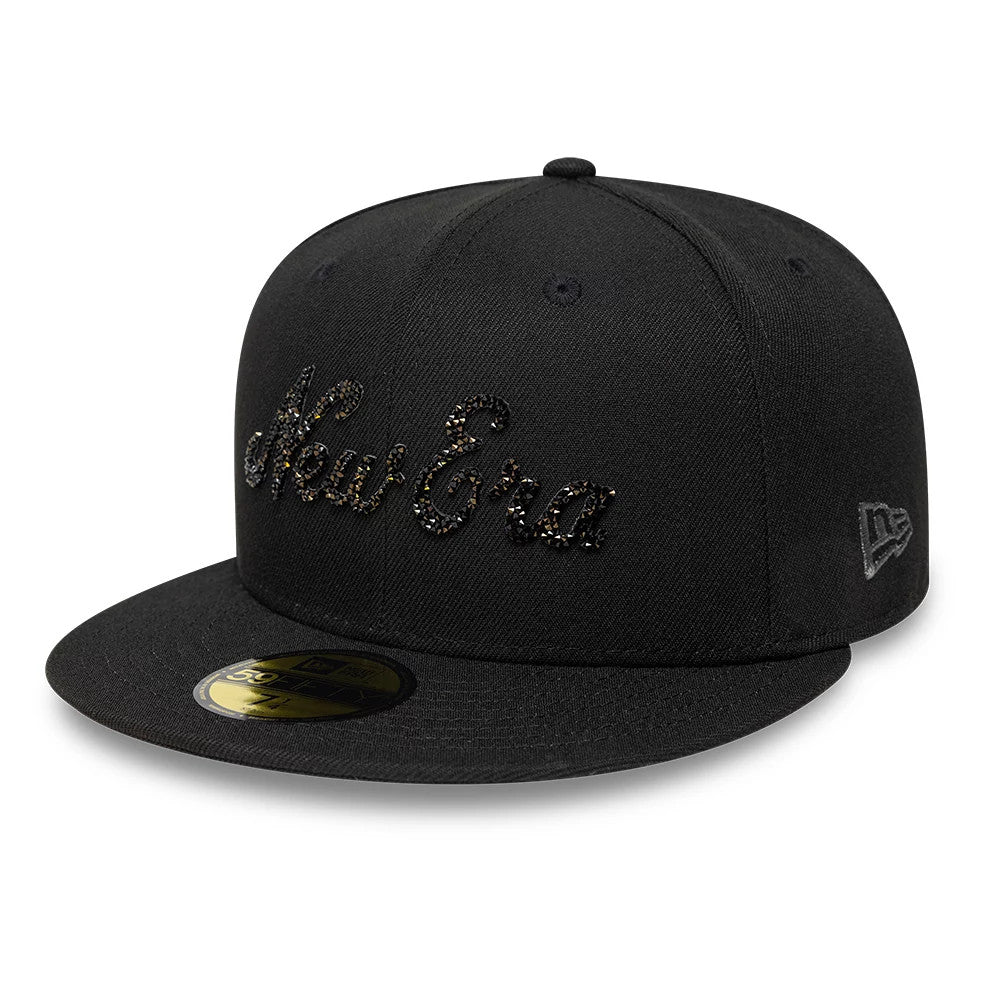 New Era Gem Black 59FIFTY Fitted Cap, front three-quarter view showing the black gemstone New Era script logo embroidered on the front panel, a black flat visor and the gold 59FIFTY size sticker on the visor.