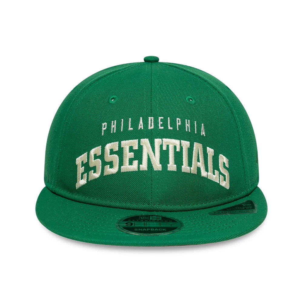 Philadelphia Eagles Fear Of God x NFL Green Retro Crown New Era 9FIFTY Adjustable Cap, front view showing white embroidered Philadelphia Essentials text on the structured green crown, with a flat visor and 9FIFTY size sticker on the visor.