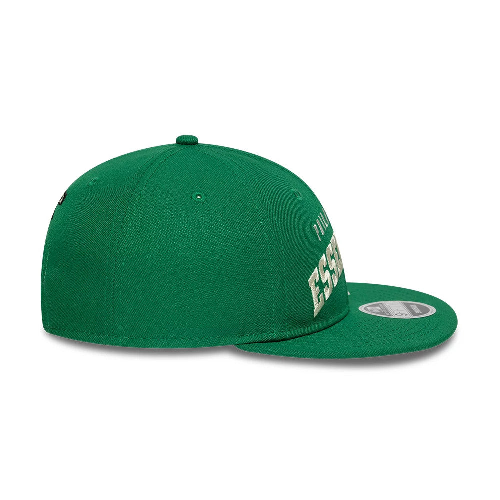 Philadelphia Eagles Fear Of God x NFL Green Retro Crown New Era 9FIFTY Adjustable Cap, side view showing the cream Essentials text embroidery on the front panel with a curved green visor and the 9FIFTY size sticker on top.