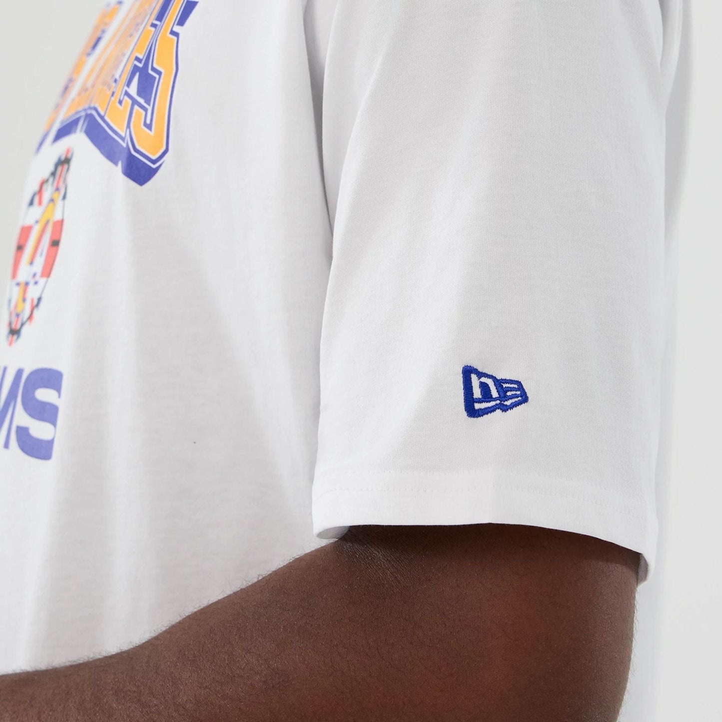 The Male model is wearing LA Rams NFL International Series Games 2025 White Oversized T-Shirt 7