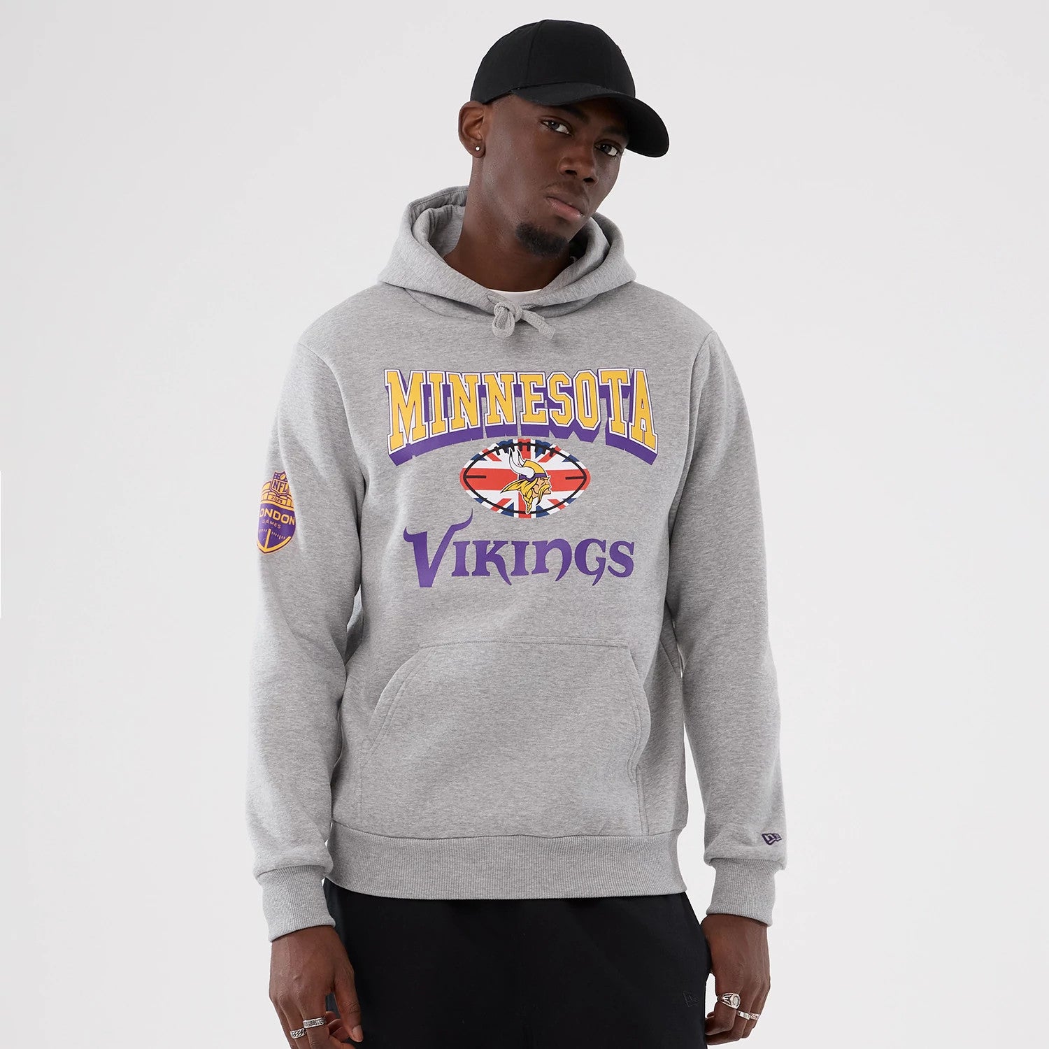 The Male model is wearing Minnesota Vikings NFL International Series Games 2025 Grey Pullover Hoodie 1