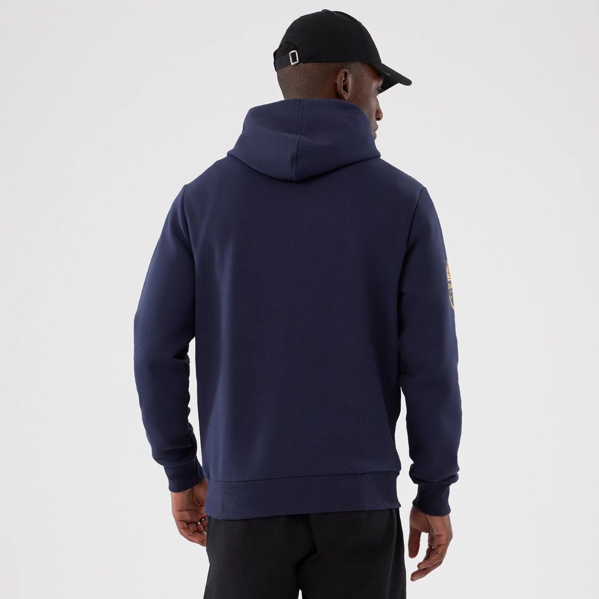 The Male model is wearing LA Rams NFL International Series Games 2025 Navy Pullover Hoodie 2