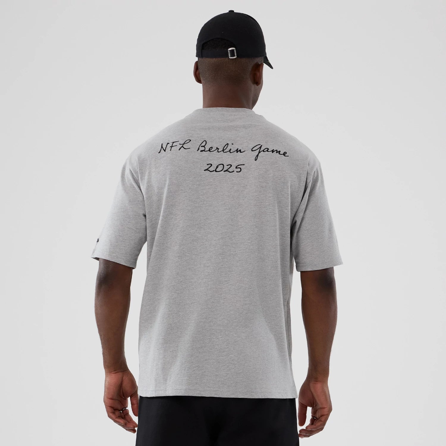The Male model is wearing Atlanta Falcons NFL International Series Games 2025 Grey Premium T-Shirt 2