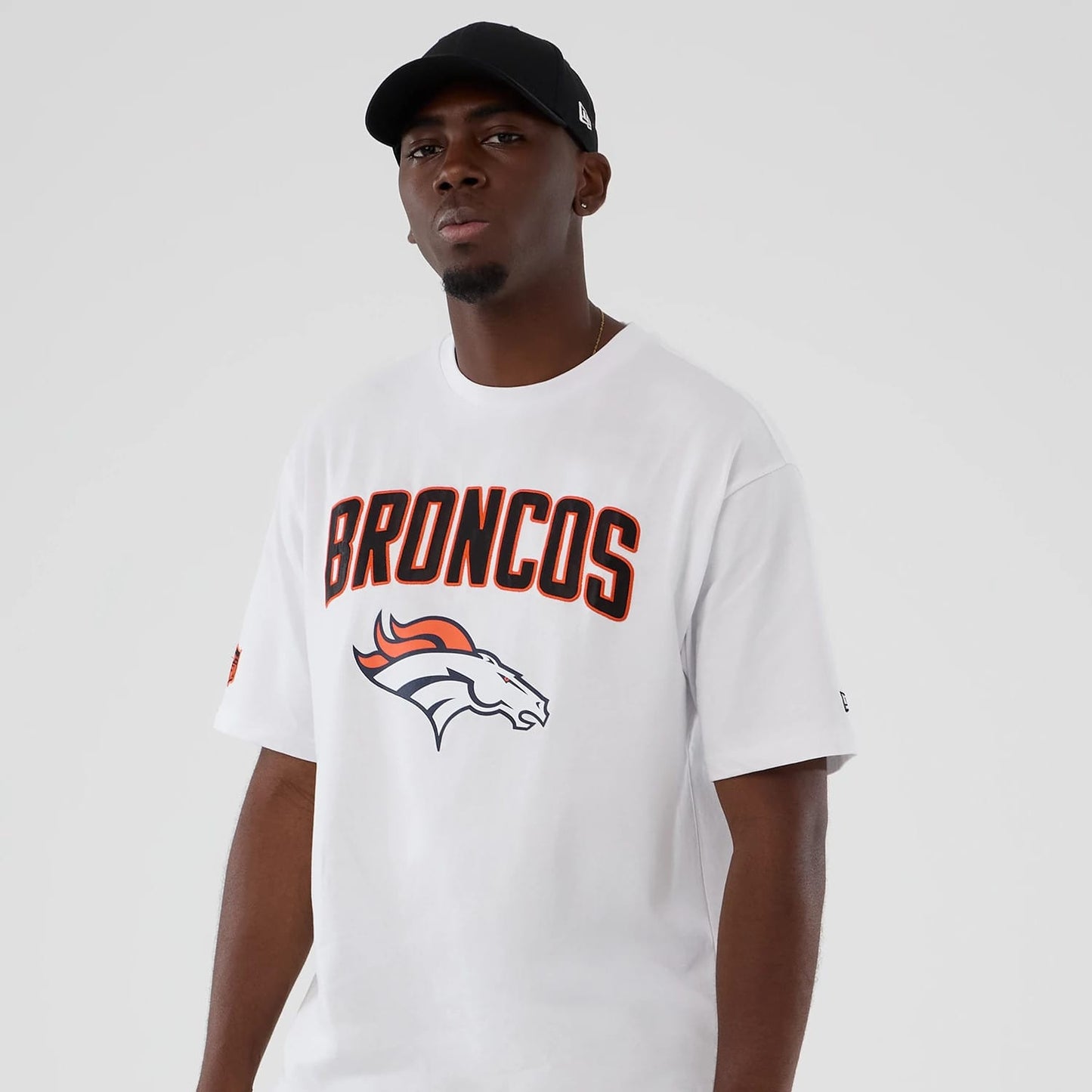The Male model is wearing Denver Broncos NFL International Series Games 2025 White Premium T-Shirt 7