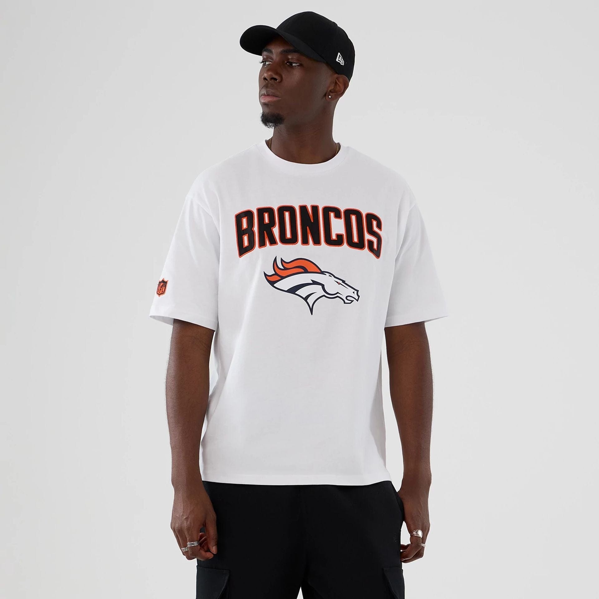 The Male model is wearing Denver Broncos NFL International Series Games 2025 White Premium T-Shirt 1