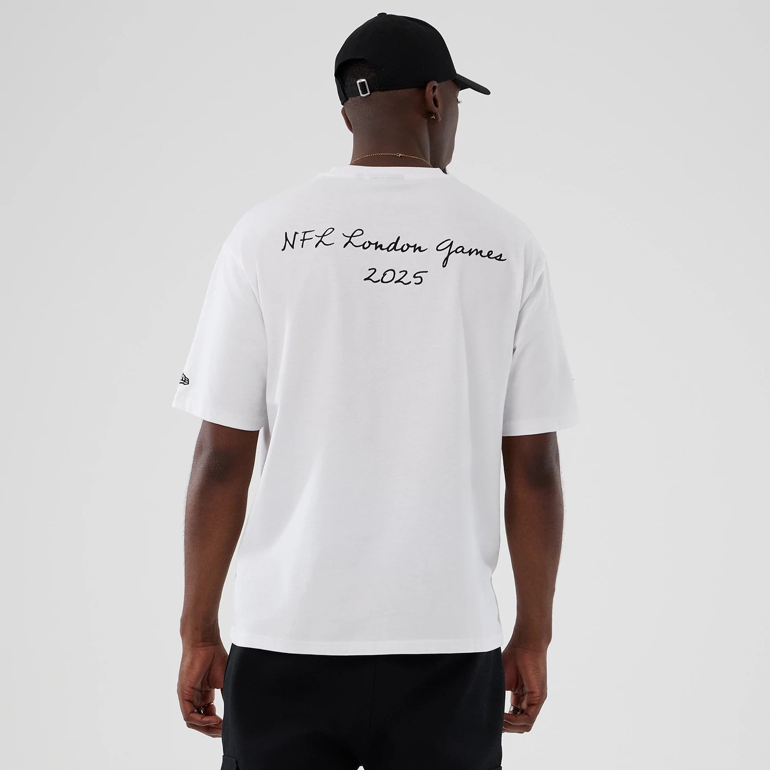 The Male model is wearing Denver Broncos NFL International Series Games 2025 White Premium T-Shirt 2