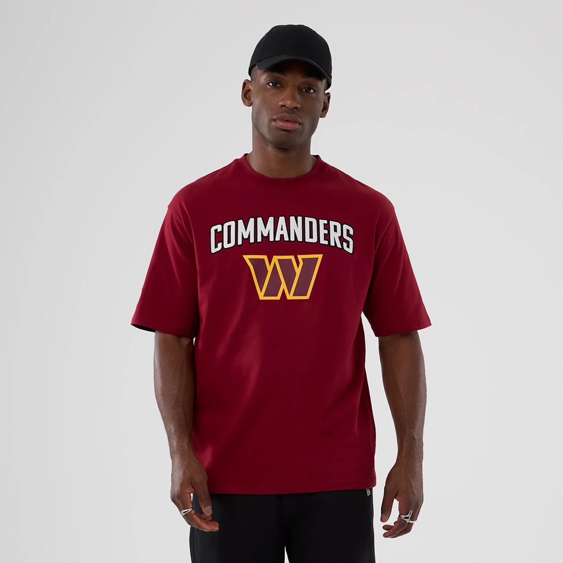 The Male model is wearing Washington Commanders NFL International Series Games 2025 Dark Red Premium T-Shirt 1