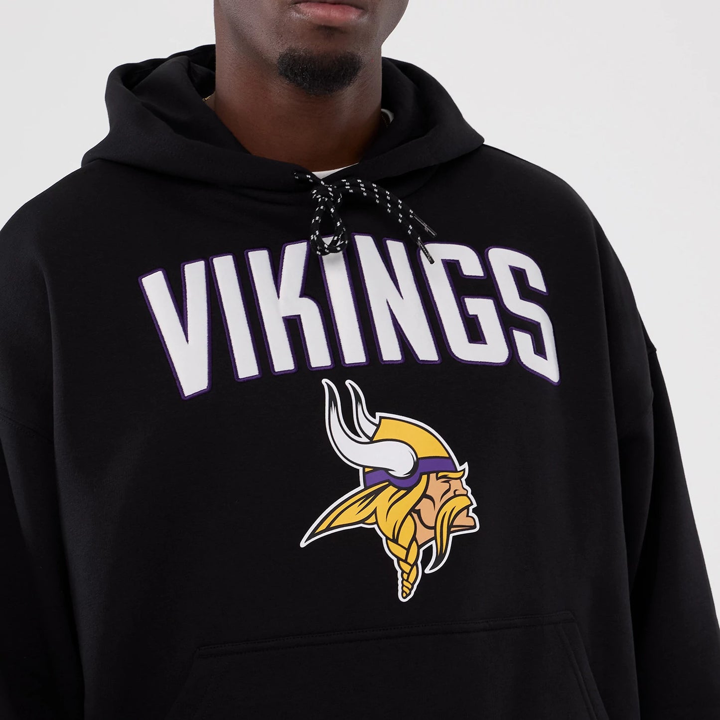 The Male model is wearing Minnesota Vikings NFL International Series Games 2025 Black Premium Pullover Hoodie 7