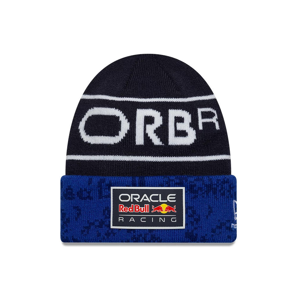 New Era Red Bull Racing Youth Team Dark Blue Cuff Knit Beanie Hat, front view showing a white ORBR design across the crown and a rectangular Oracle Red Bull Racing logo patch on the blue cuff with patterned texture.