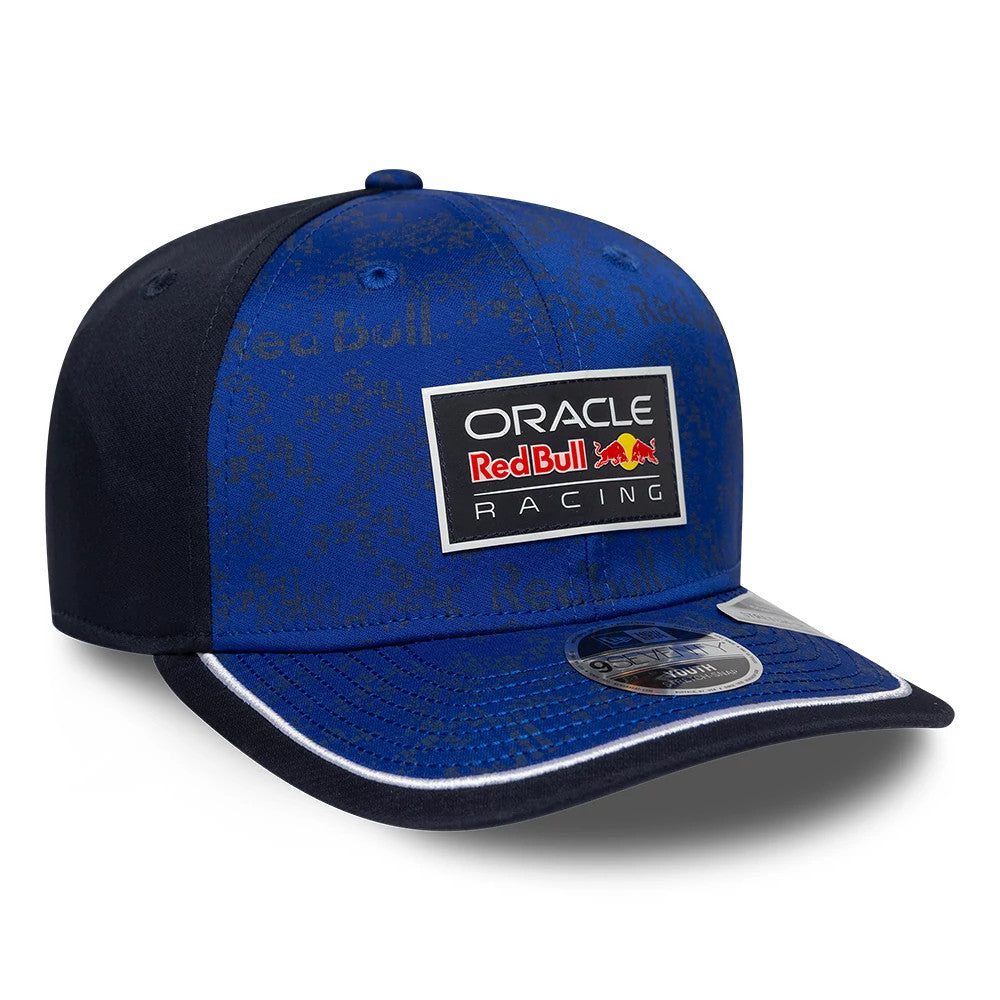 Red Bull Racing Youth Team Dark Blue New Era 9SEVENTY Stretch Snap Adjustable Cap, three-quarter view showing a large Oracle Red Bull Racing logo on the blue front panel, dark blue visor with white trim, and 9SEVENTY size sticker.