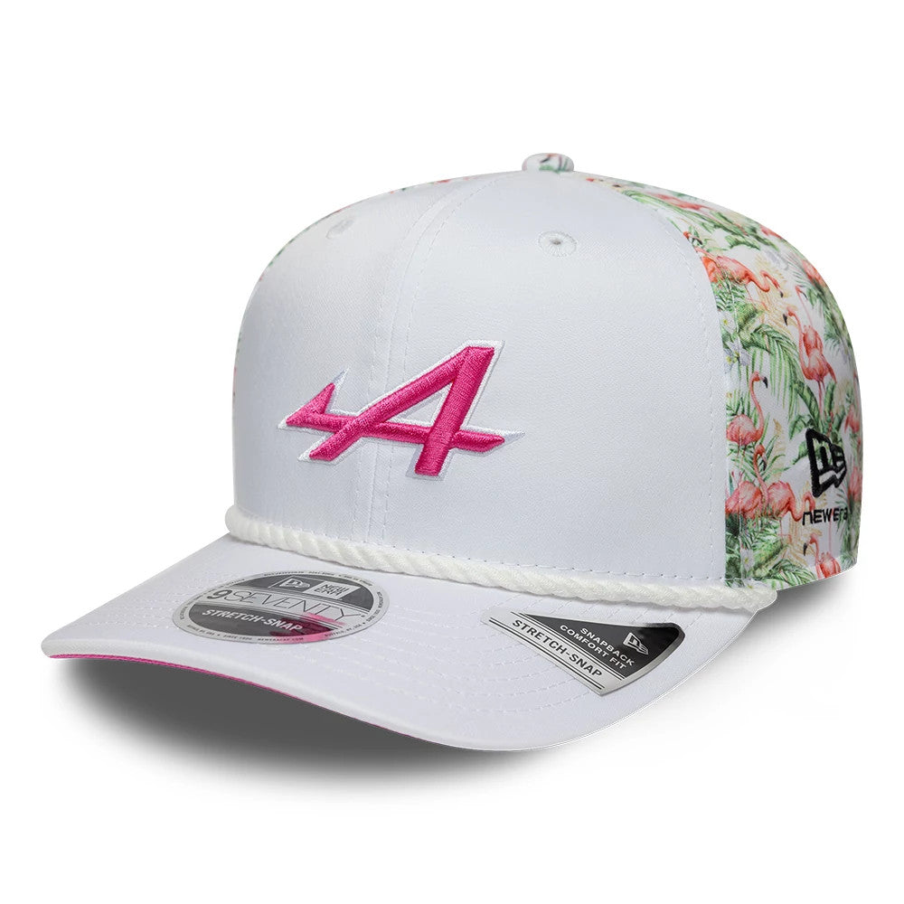 Alpine Racing Miami Race Special White New Era 9SEVENTY Stretch Snap Adjustable Cap, three-quarter view showing the pink embroidered A logo on the front panel, floral side panels, white visor with contrasting pink underside and 9SEVENTY size sticker.