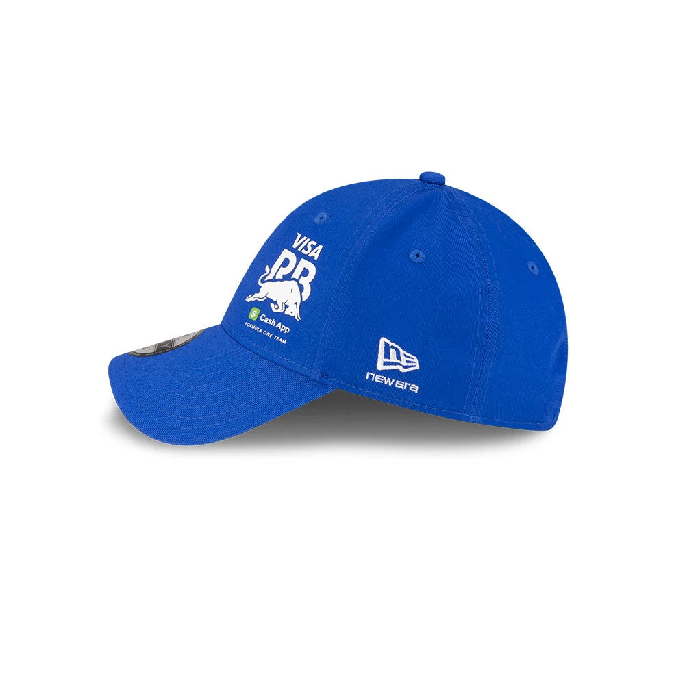 Visa Cash App Racing Bulls Essential Bright Blue New Era 9FORTY Adjustable Cap, side view showing the white embroidered Visa PBR logo with a bull on the front panel and the New Era flag logo on the left side above the curved bright blue visor.