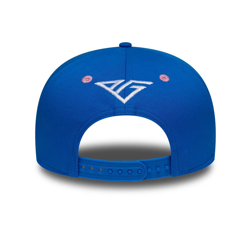 Alpine Racing Pierre Gasly Blue New Era 9SEVENTY Stretch Snap Adjustable Cap, rear view showing the white embroidered AG logo centred above the blue snap closure on the blue crown, with pink embroidered eyelets.