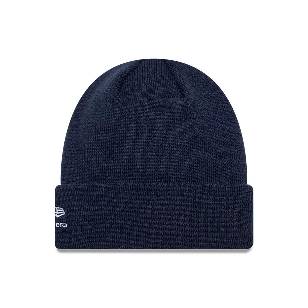 New Era Alpine Racing Essential Dark Blue Cuff Knit Beanie Hat, front view showing the turned-up cuff with the white embroidered New Era flag logo on the left side, set against a deep blue knit fabric.