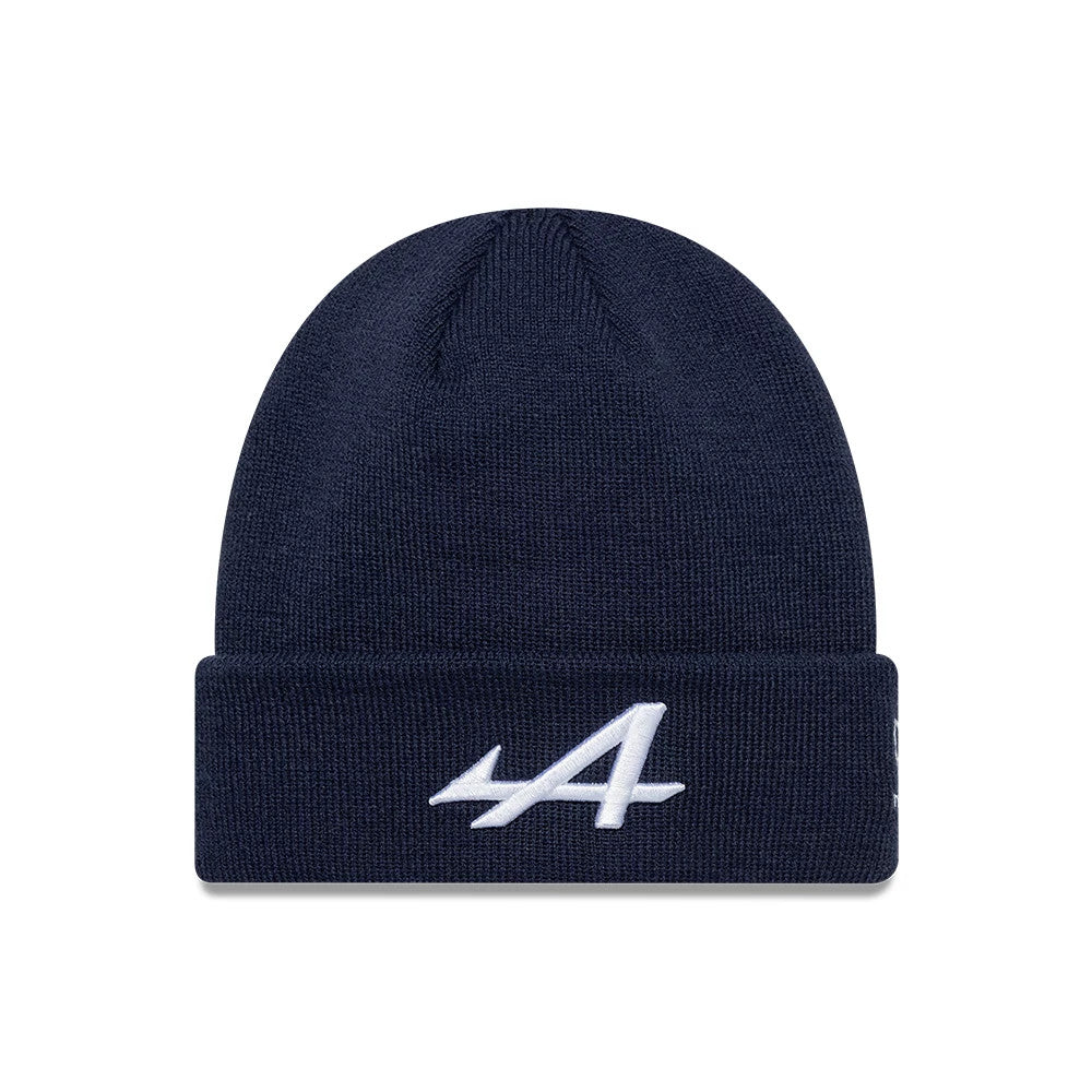 New Era Alpine Racing Essential Dark Blue Cuff Knit Beanie Hat, front view showing a white embroidered A logo on the turned-up cuff, with a ribbed knit texture and a deep dark blue colour.