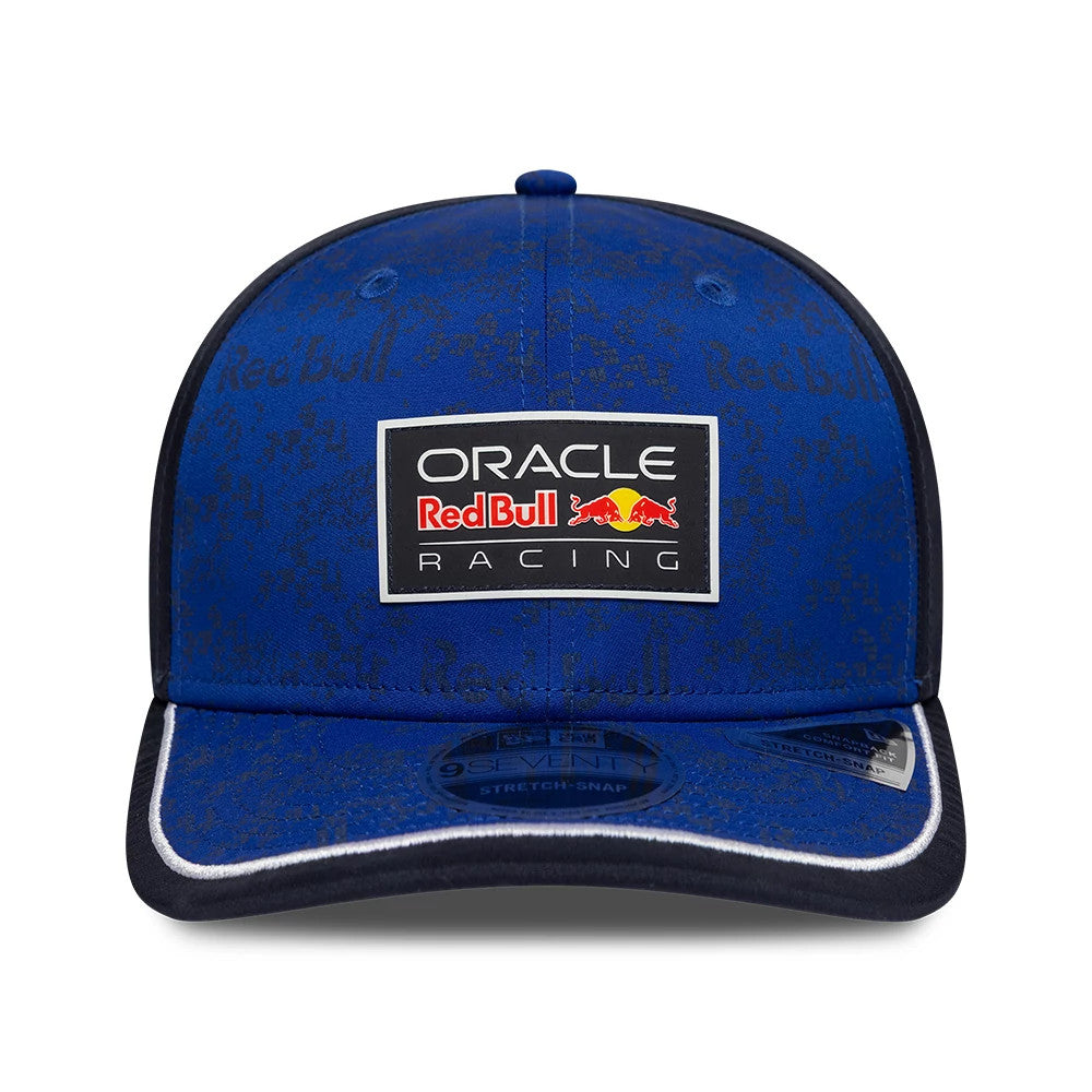 Red Bull Racing Team Dark Blue New Era 9SEVENTY Stretch Snap Adjustable Cap, front view showing the Oracle Red Bull Racing patch on the panel, dark blue visor with white piping, and a 9SEVENTY size sticker on the black undervisor.