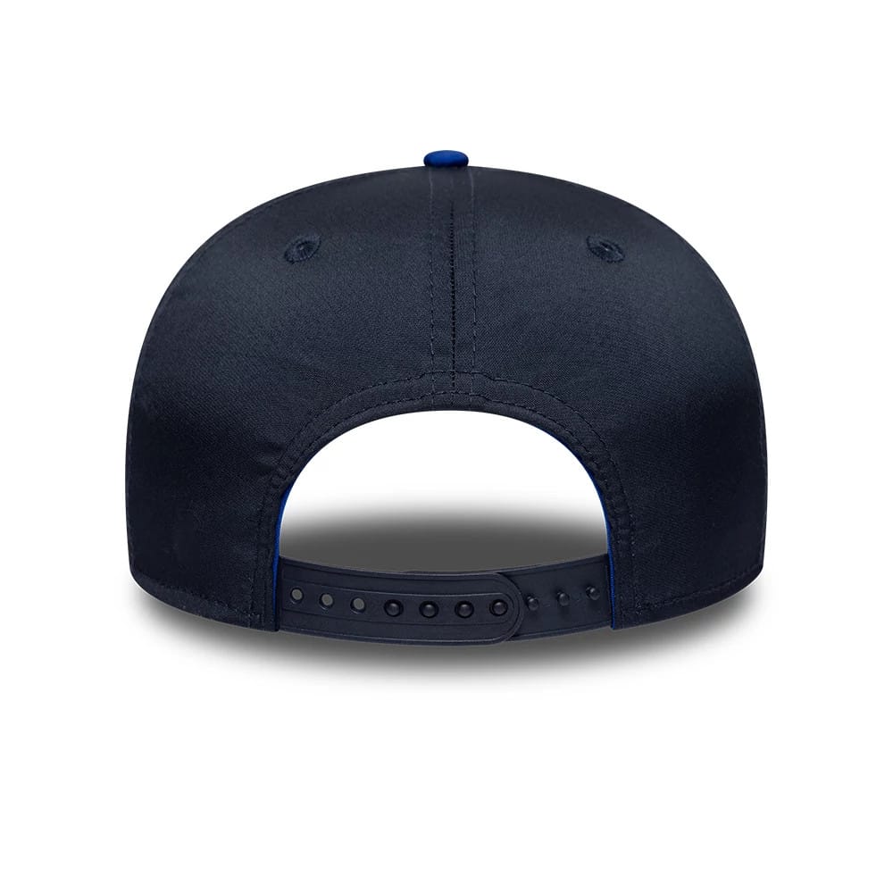 Red Bull Racing Max Verstappen Dark Blue New Era 9SEVENTY Stretch Snap Adjustable Cap, rear view showing the dark blue adjustable snap closure and a structured crown with embroidered eyelets and top button.