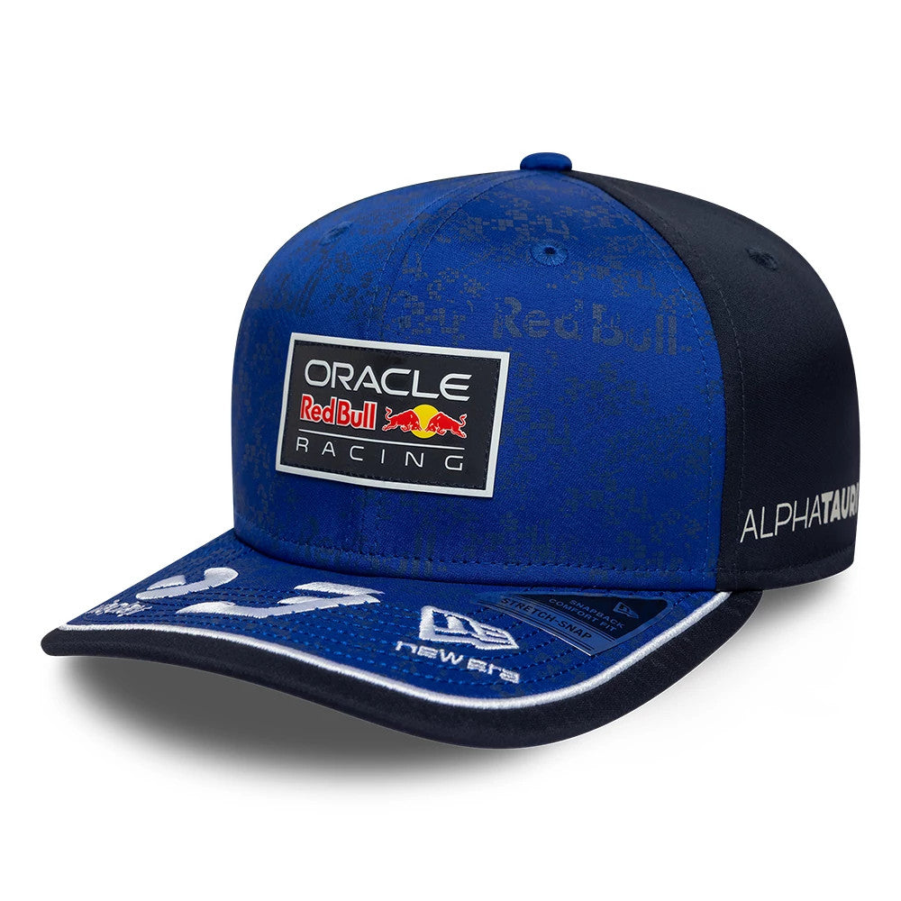 Red Bull Racing Max Verstappen Dark Blue New Era 9SEVENTY Stretch Snap Adjustable Cap, three-quarter view showing the raised Red Bull Racing logo on the front panel, dark blue curved visor with white accents, and New Era flag logo on the left side.