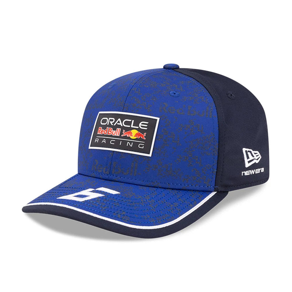 Red Bull Racing Isack Hadjar Dark Blue New Era 9SEVENTY Stretch Snap Adjustable Cap, three-quarter view showing the embroidered Red Bull Racing patch on the front panel, white logo on the visor, and New Era flag logo on the left side.