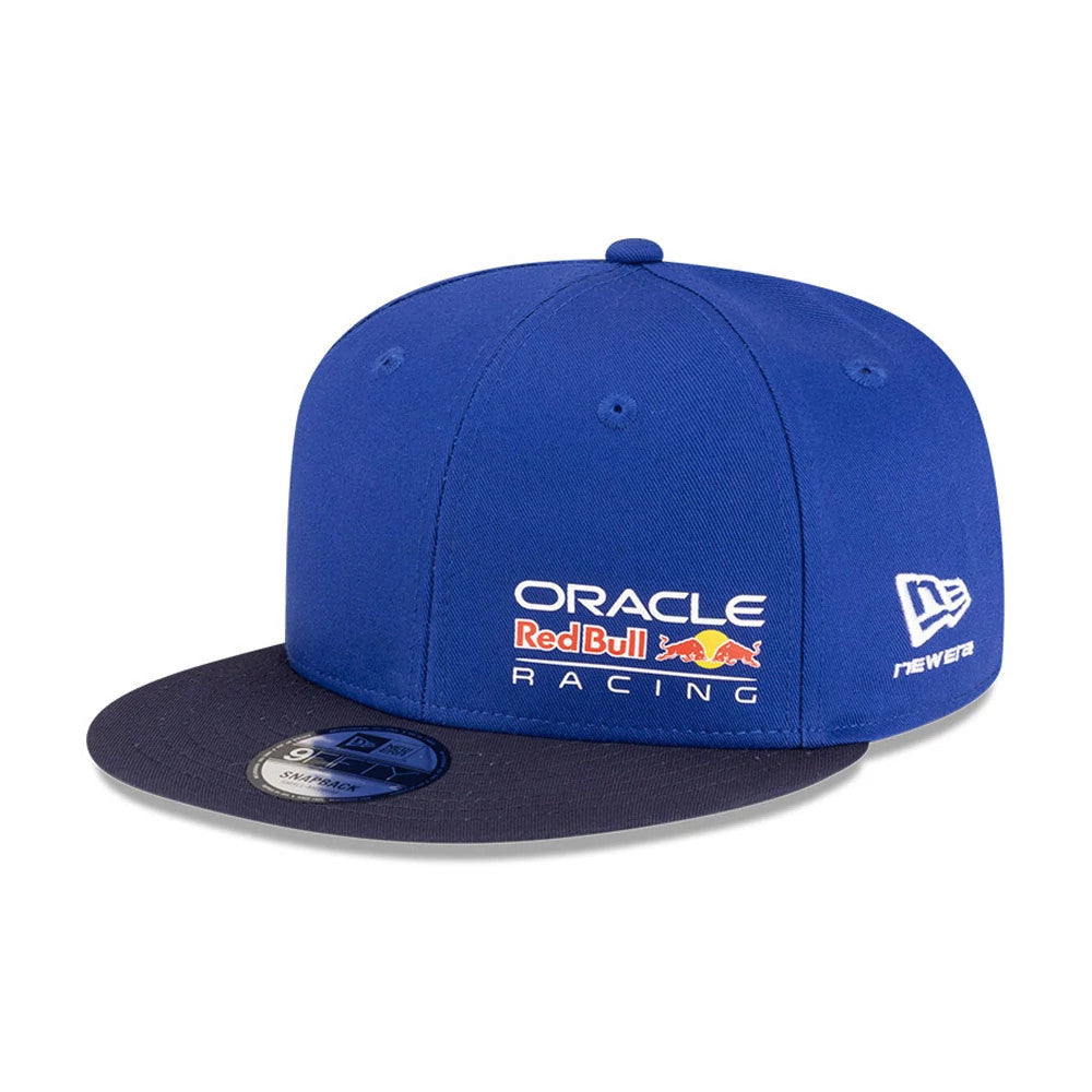 Pictured is this Essential Red Bull Racing 9FIFTY Snapback Adjustable cap in dark blue. 1