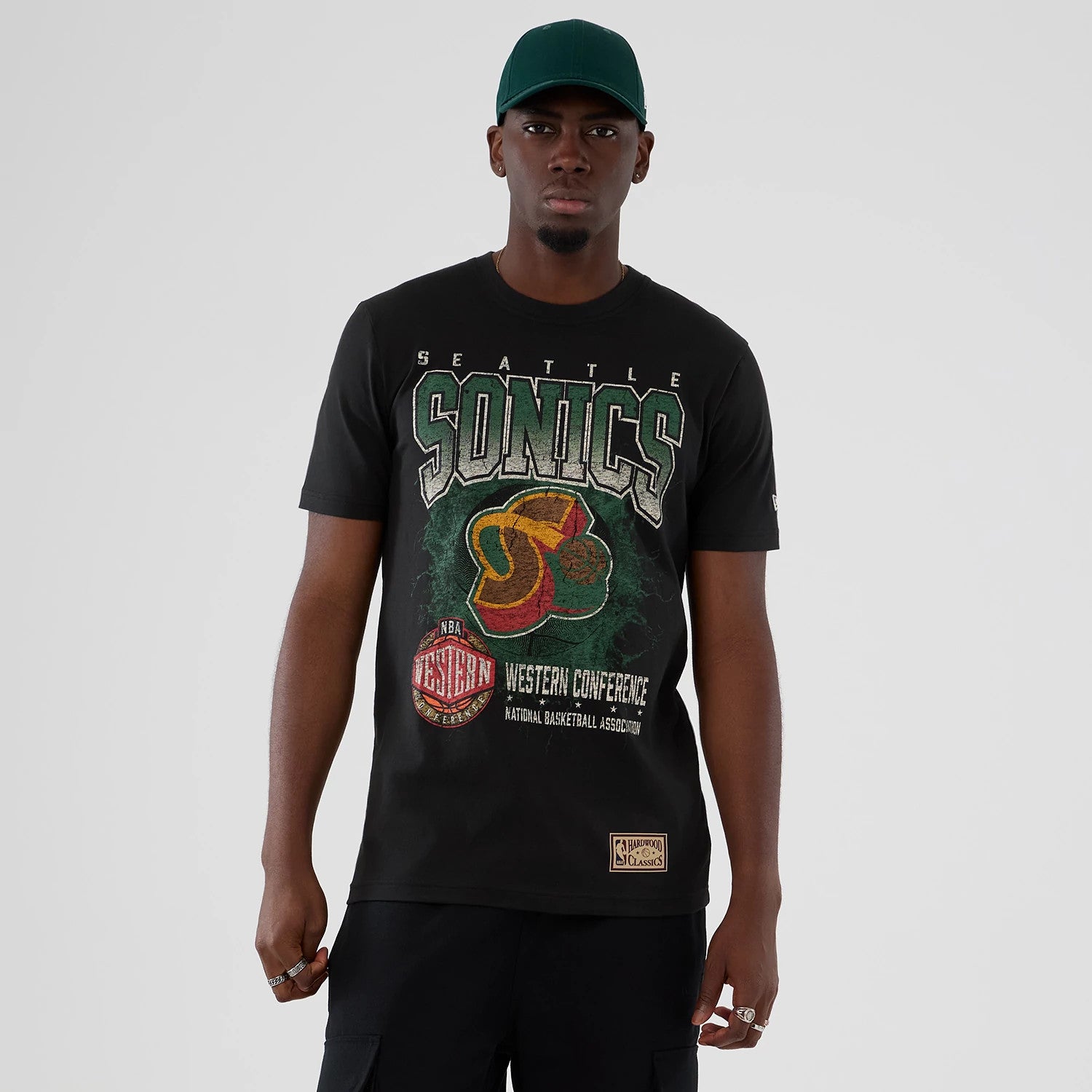The model is wearing this NBA Hardwood Classic Seattle Supersonics T-Shirt in black. 1