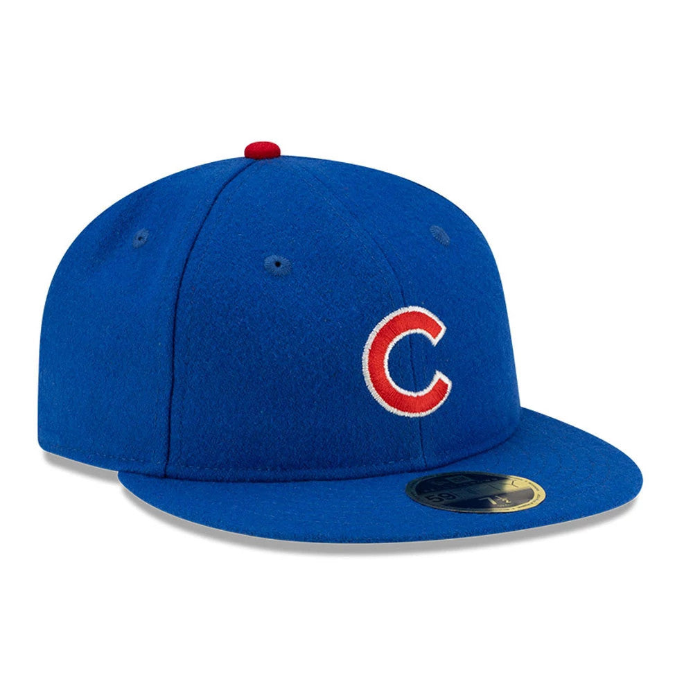 Chicago Cubs FOG X MLB Blue Retro Crown New Era 59FIFTY Fitted Cap, three-quarter view showing the red and white embroidered C logo on the front panel, with a blue visor and gold 59FIFTY size sticker on the flat-visor.