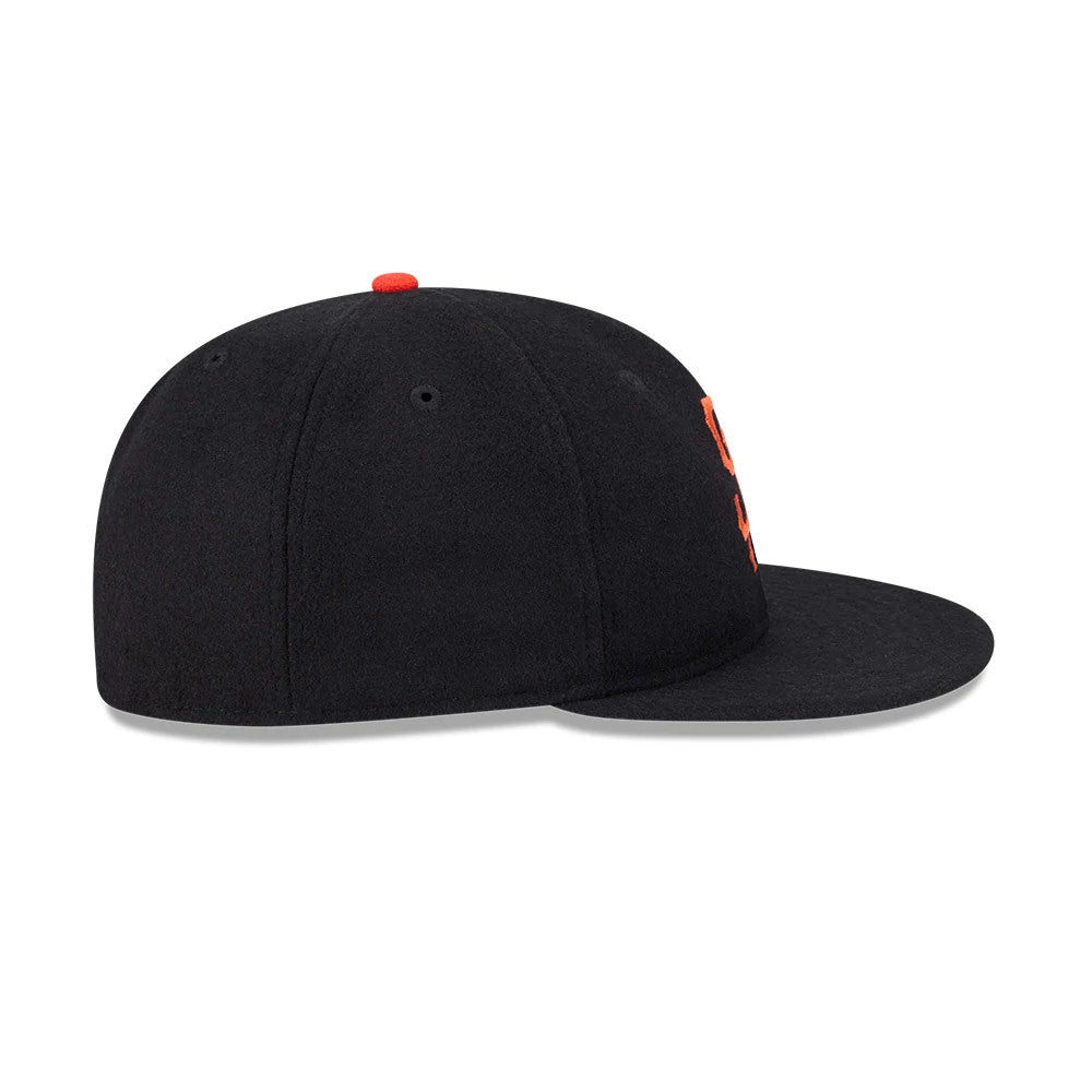 San Francisco Giants FOG X MLB Black Retro Crown New Era 59FIFTY Fitted Cap, side view showing the orange embroidered logo on the structured black crown, with a flat visor and a red top button.