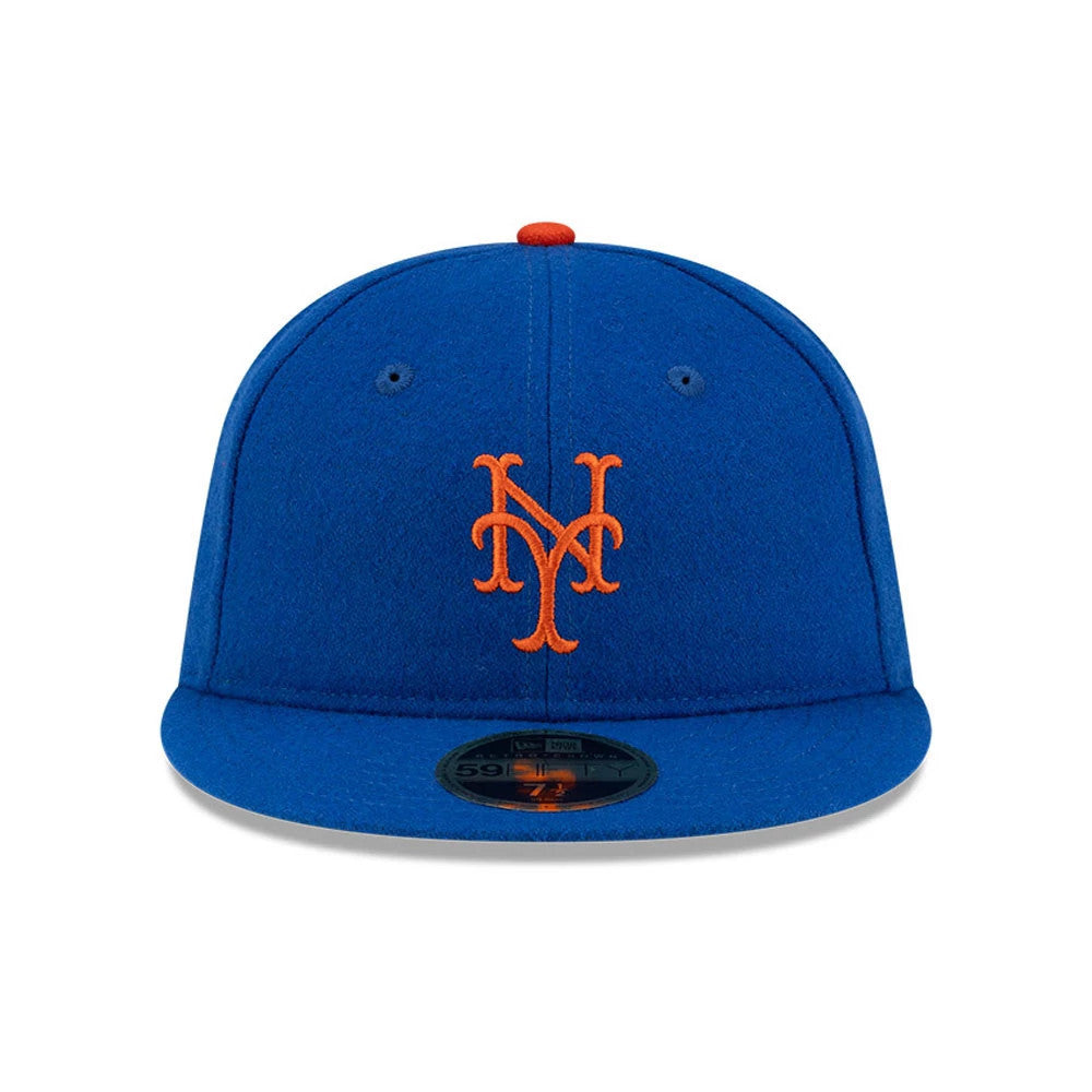 New York Mets FOG X MLB Blue Retro Crown New Era 59FIFTY Fitted Cap, front view showing the orange raised embroidered NY logo on the structured blue crown, with a black 59FIFTY size sticker on the flat visor and orange top button.