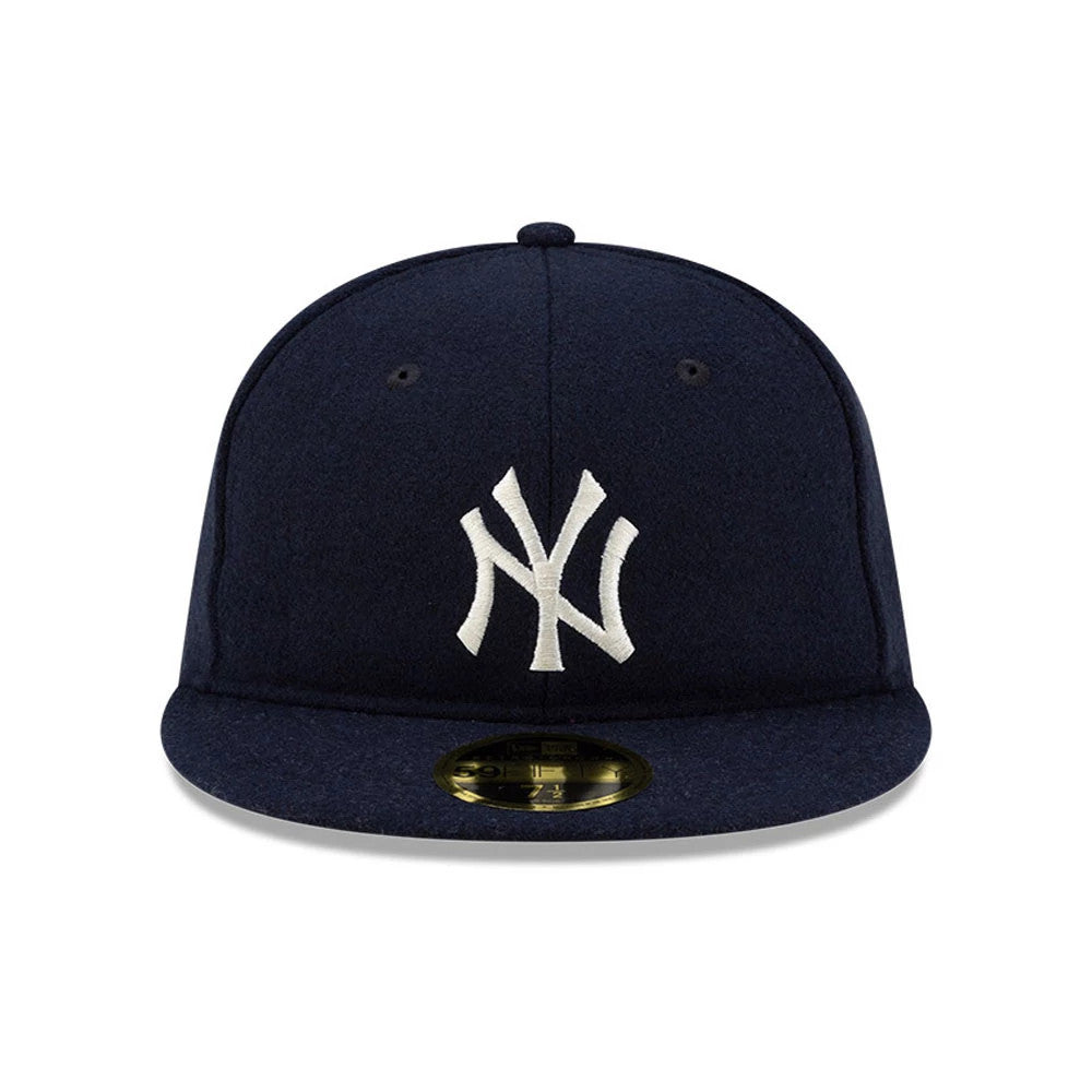 New York Yankees FOG X MLB Navy Retro Crown New Era 59FIFTY Fitted Cap, front view showing the white embroidered NY logo on the structured navy crown, with a matching navy visor and a gold 59FIFTY size sticker.