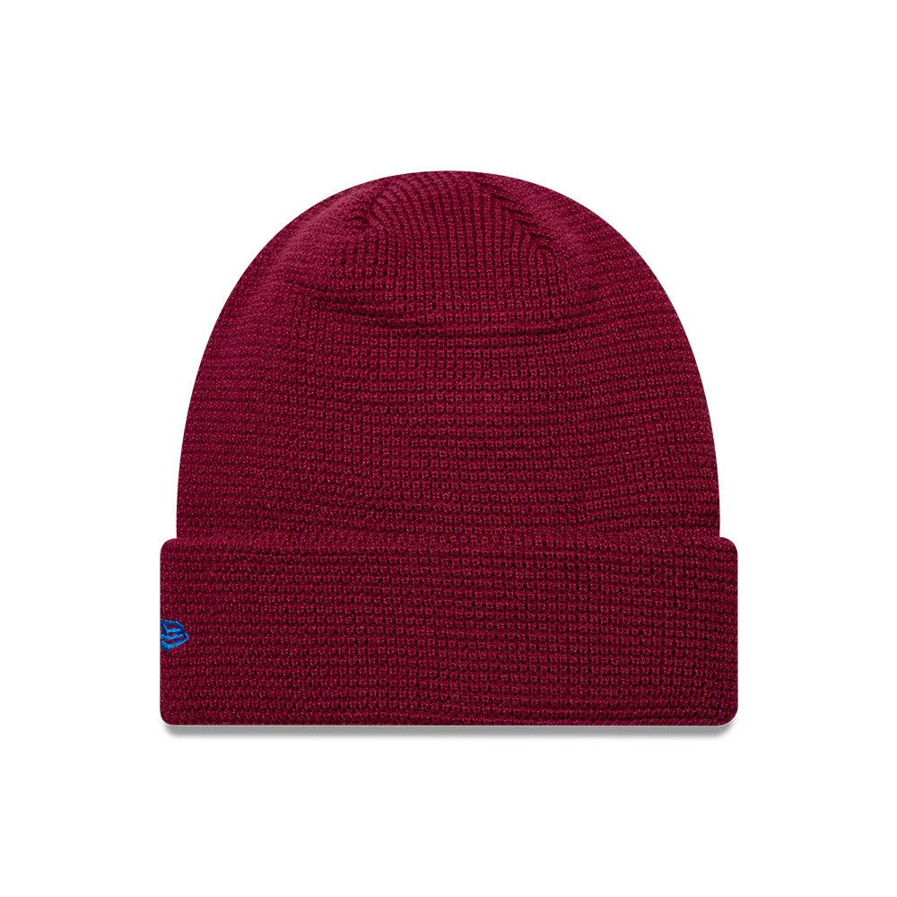 EDWIN x New Era Dark Red Cuff knit Beanie Hat, front view showing a textured knit pattern with a turned-up cuff and contrasting blue New Era flag logo embroidered on the left side.