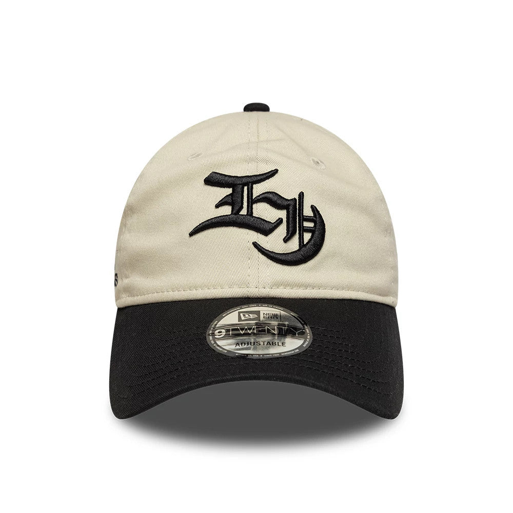 EDWIN x New Era Cream & Black 9TWENTY Adjustable Cap, front view showing black embroidered lettering on the cream crown, black visor with 9TWENTY size sticker, and top button in black.
